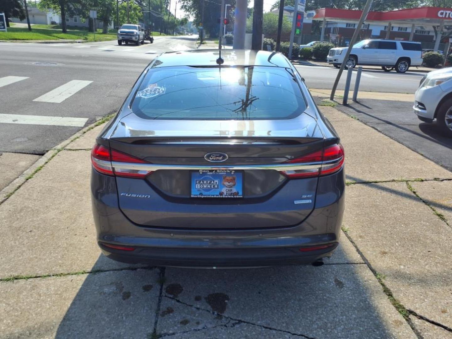 2017 Magnetic Ford Fusion SE (3FA6P0HD3HR) with an 1.5L EcoBoost 1.5L Turbo I4 181hp 185ft. lbs. Direct Injection engine, 6-Speed Shiftable Automatic transmission, located at 5505 N. Summit St., Toledo, OH, 43611, (419) 729-2688, 41.654953, -83.530014 - Photo#20