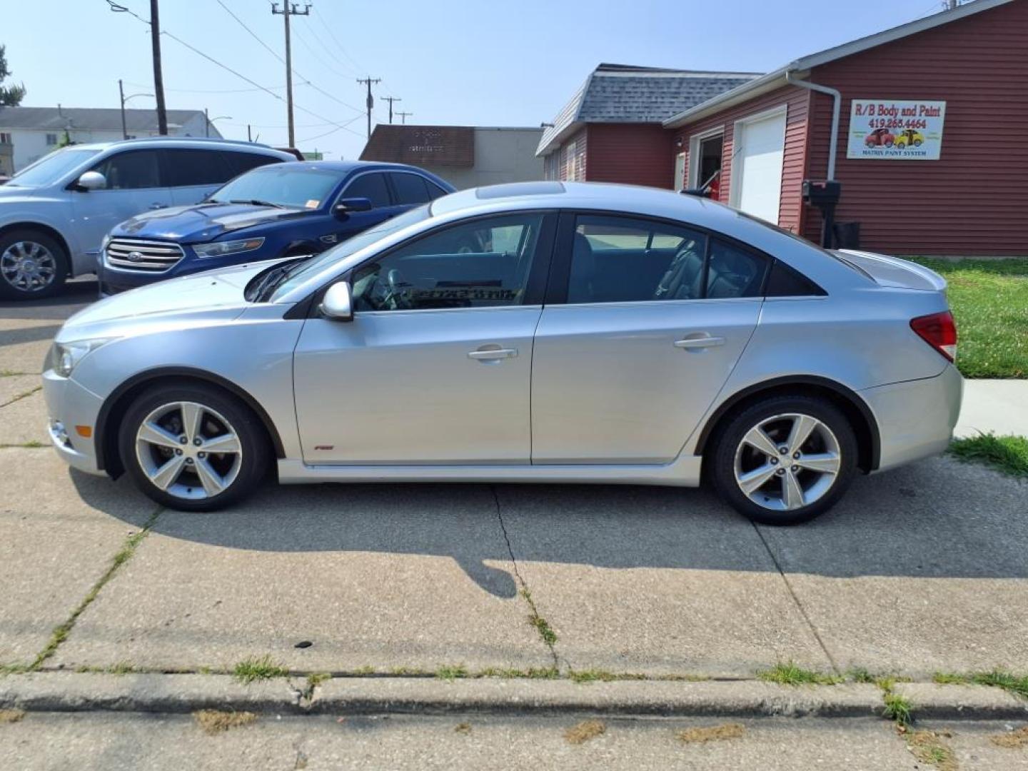 2014 Silver Ice Metallic Chevrolet Cruze 2LT Auto (1G1PE5SBXE7) with an 1.4L Ecotec 1.4L Turbo I4 138hp 148ft. lbs. Sequential Multiport Fuel Injection engine, 6-Speed Shiftable Automatic transmission, located at 5505 N. Summit St., Toledo, OH, 43611, (419) 729-2688, 41.654953, -83.530014 - Photo#21