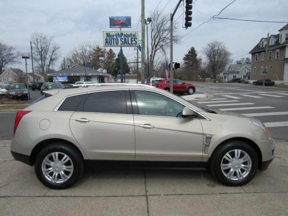 2012 Gold Mist Metallic Cadillac SRX Luxury Collection AWD (3GYFNDE35CS) with an 3.6 6 Cylinder Direct Injection engine, 6-Speed Shiftable Automatic transmission, located at 5505 N. Summit St., Toledo, OH, 43611, (419) 729-2688, 41.654953, -83.530014 - Photo #0