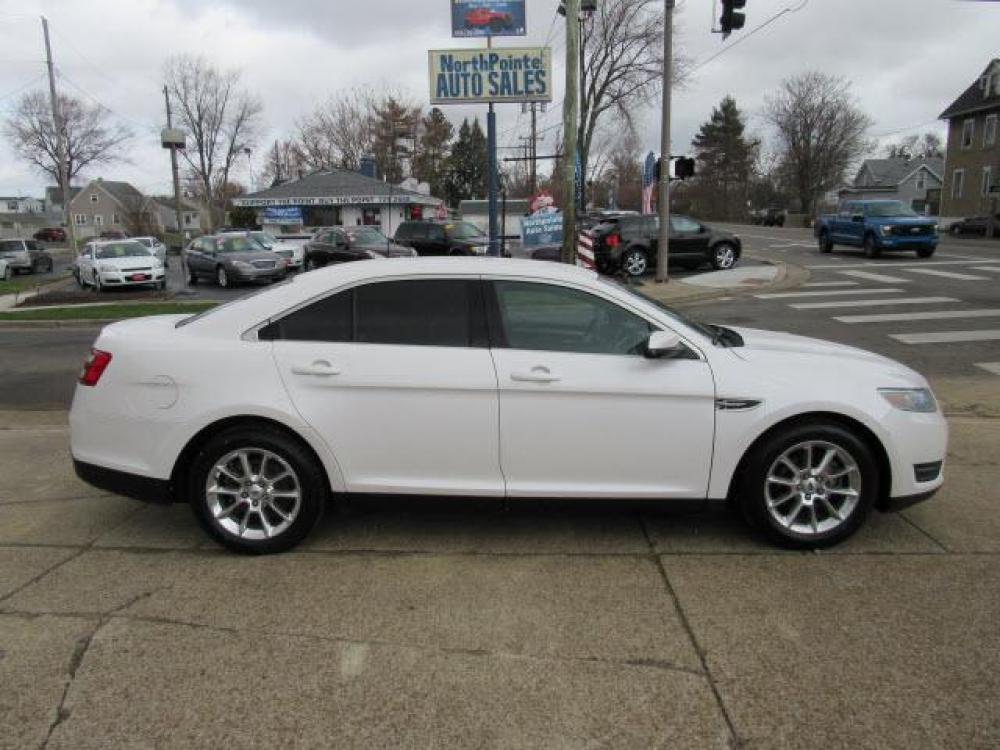 2013 White Platinum Metallic Tri-Coat Ford Taurus SEL (1FAHP2E80DG) with an 3.5 6 Cylinder Sequential Multiport Fuel Injection engine, 6-Speed Shiftable Automatic transmission, located at 5505 N. Summit St., Toledo, OH, 43611, (419) 729-2688, 41.654953, -83.530014 - Photo #0