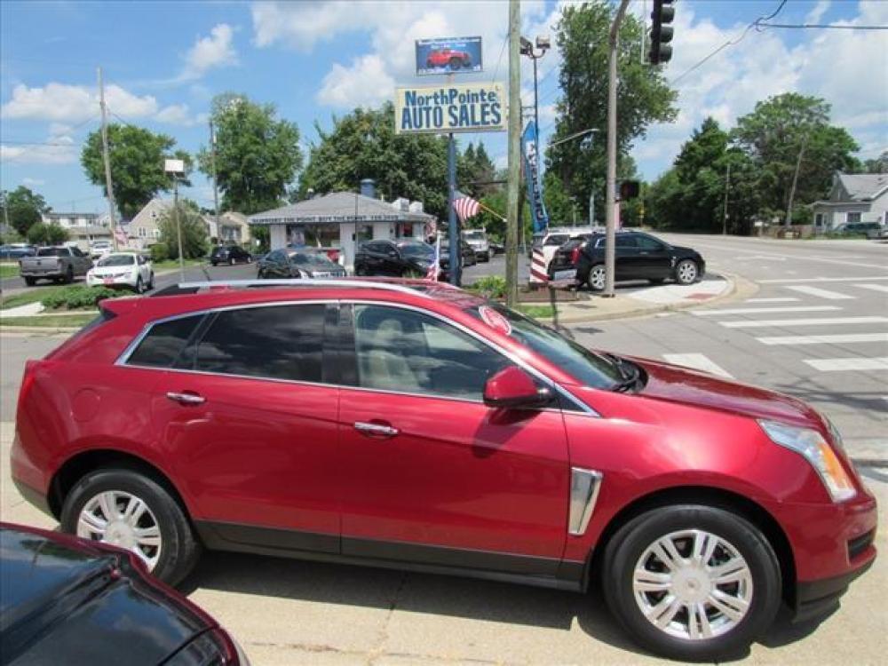 2013 Crystal Red Tintcoat Cadillac SRX Luxury Collection (3GYFNCE36DS) with an 3.6 6 Cylinder Direct Injection engine, 6-Speed Shiftable Automatic transmission, located at 5505 N. Summit St., Toledo, OH, 43611, (419) 729-2688, 41.654953, -83.530014 - Photo #0