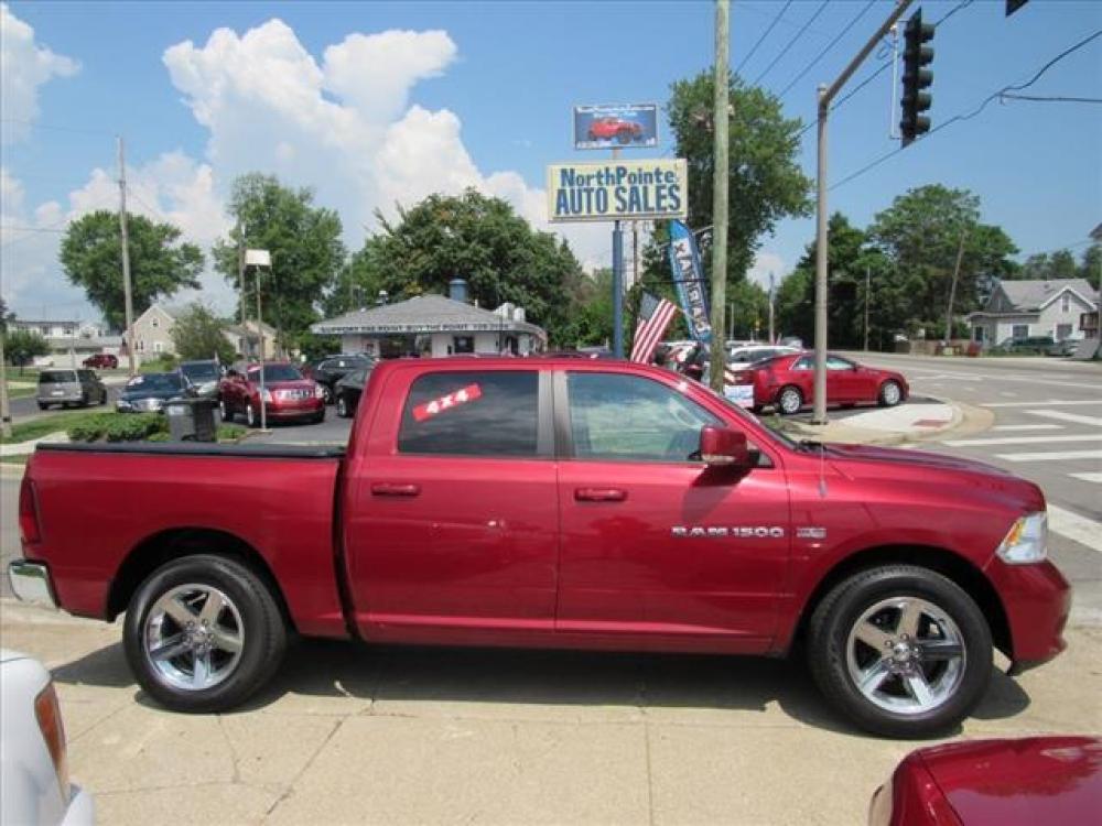 2012 Deep Cherry Red Crystal Pearl Coat RAM 1500 Sport 4X4 (1C6RD7MT4CS) with an 5.7 8 Cylinder Sequential Multiport Fuel Injection engine, 6-Speed Automatic transmission, located at 5505 N. Summit St., Toledo, OH, 43611, (419) 729-2688, 41.654953, -83.530014 - Photo #0