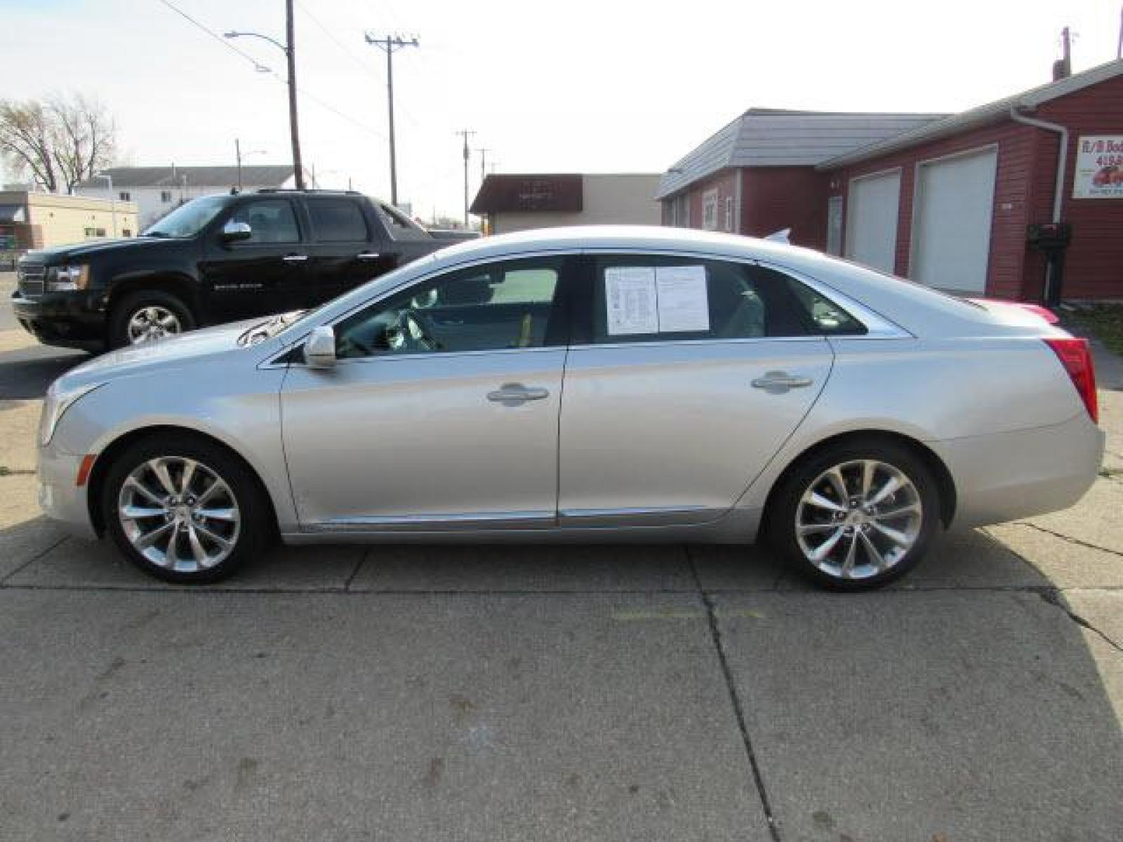 2013 Radiant Silver Metallic Cadillac XTS Luxury Collection AWD (2G61R5S30D9) with an 3.6 6 Cylinder Direct Injection engine, 6-Speed Shiftable Automatic transmission, located at 5505 N. Summit St., Toledo, OH, 43611, (419) 729-2688, 41.654953, -83.530014 - A premium 'turn by turn' navigation system is included. Pack up your clubs AND your buddy's clubs too! Plenty of cargo room for anything you want to take! Extra clean. No rips, no abuse, no cigarette burns. Bring your Digital Music collection to life. This baby is ready to RoCk! Just Plug It In! C - Photo #23