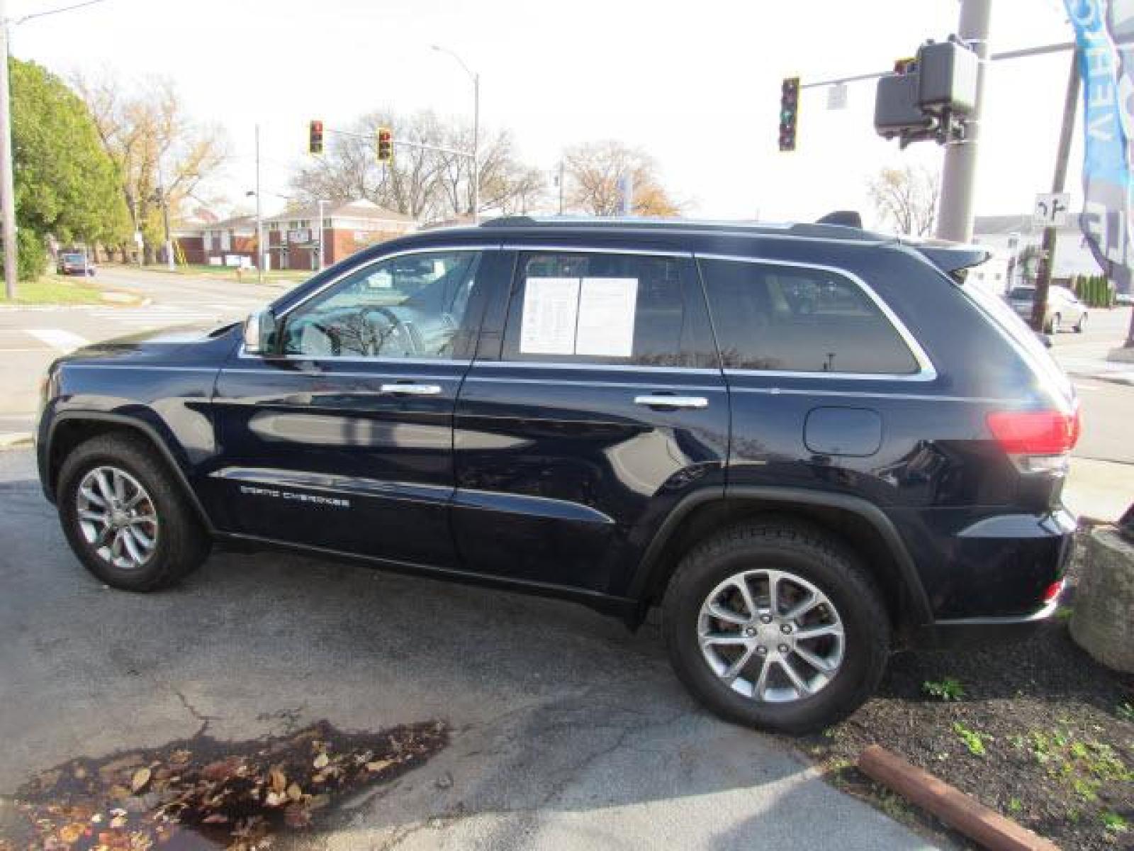 2014 Pacific Blue Clear Coat Jeep Grand Cherokee Limited 4X4 (1C4RJFBG5EC) with an 3.6 6 Cylinder Sequential Multiport Fuel Injection engine, 8-Speed Shiftable Automatic transmission, located at 5505 N. Summit St., Toledo, OH, 43611, (419) 729-2688, 41.654953, -83.530014 - Photo #24