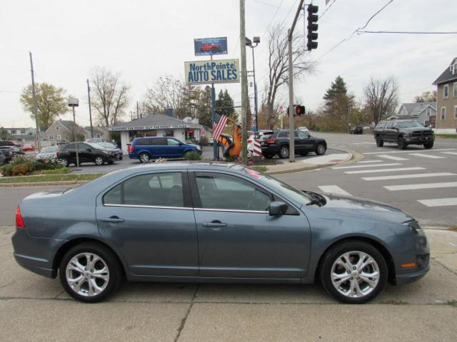 2012 Blue Flame Metallic Ford Fusion SE (3FAHP0HA2CR) with an 2.5 4 Cylinder Sequential Multiport Fuel Injection engine, 6-Speed Automatic transmission, located at 5505 N. Summit St., Toledo, OH, 43611, (419) 729-2688, 41.654953, -83.530014 - Photo #0