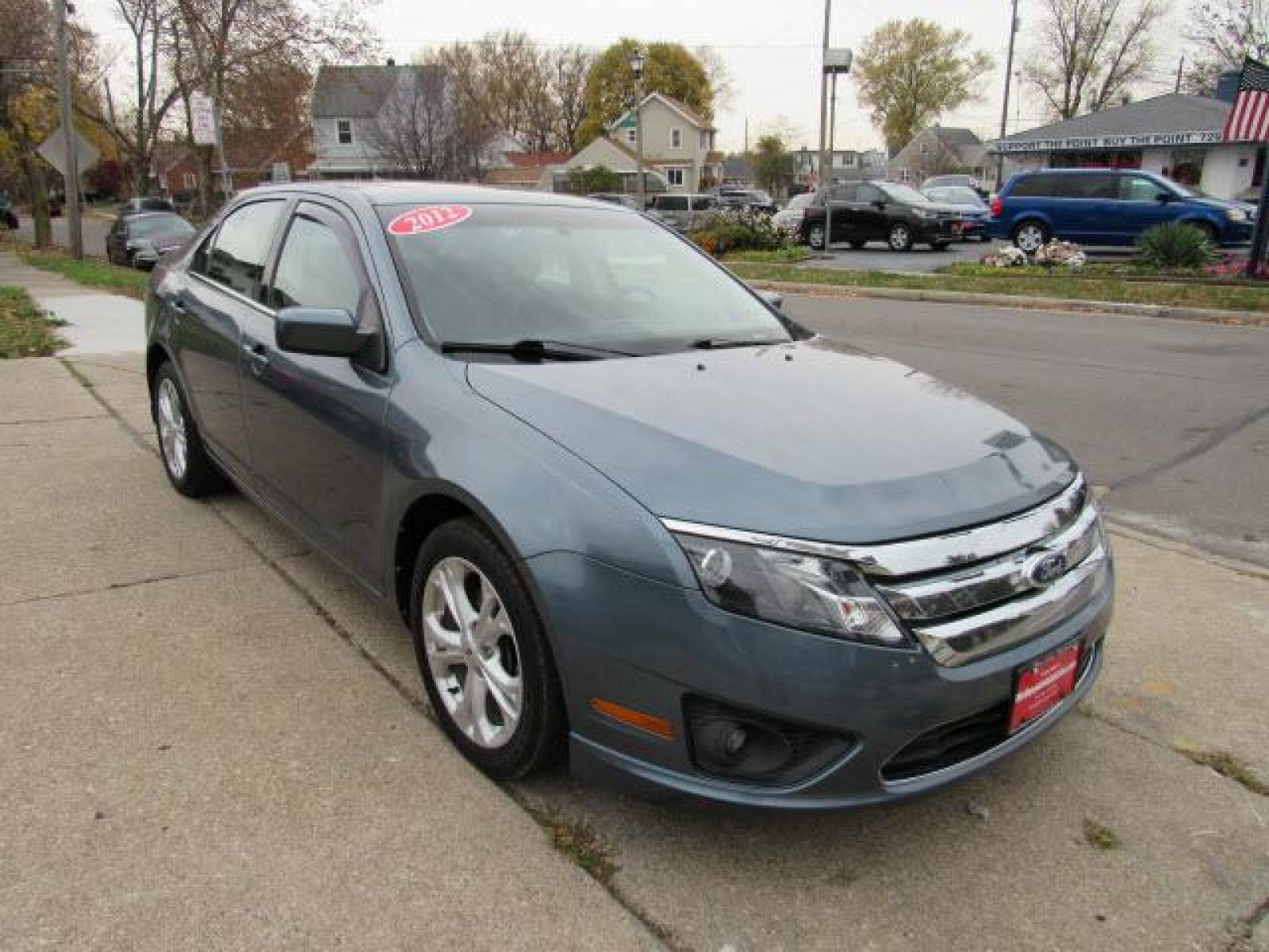 2012 Blue Flame Metallic Ford Fusion SE (3FAHP0HA2CR) with an 2.5 4 Cylinder Sequential Multiport Fuel Injection engine, 6-Speed Automatic transmission, located at 5505 N. Summit St., Toledo, OH, 43611, (419) 729-2688, 41.654953, -83.530014 - Photo #15