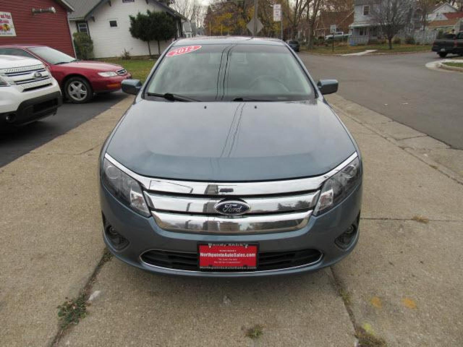 2012 Blue Flame Metallic Ford Fusion SE (3FAHP0HA2CR) with an 2.5 4 Cylinder Sequential Multiport Fuel Injection engine, 6-Speed Automatic transmission, located at 5505 N. Summit St., Toledo, OH, 43611, (419) 729-2688, 41.654953, -83.530014 - Photo #16