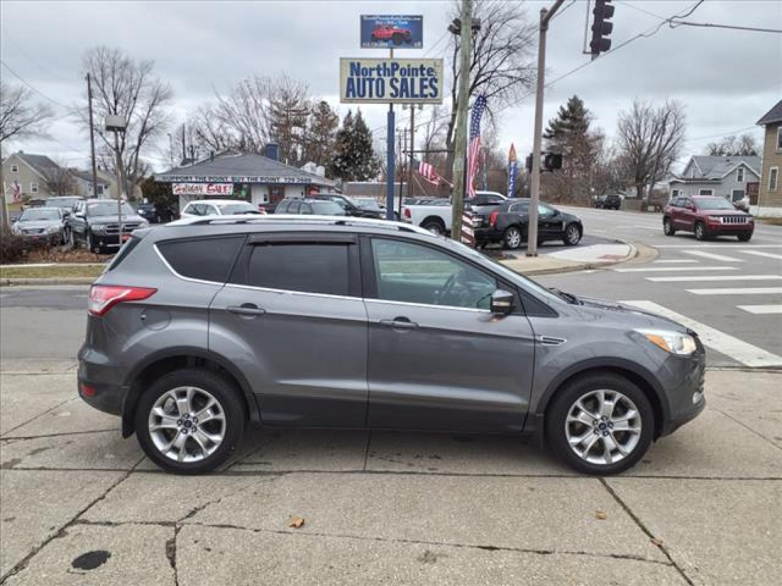 2014 Sterling Gray Metallic Ford Escape Titanium (1FMCU9J99EU) with an 2.0L EcoBoost 2.0L Turbo I4 24 Direct Injection engine, 6-Speed Shiftable Automatic transmission, located at 5505 N. Summit St., Toledo, OH, 43611, (419) 729-2688, 41.654953, -83.530014 - Photo #0
