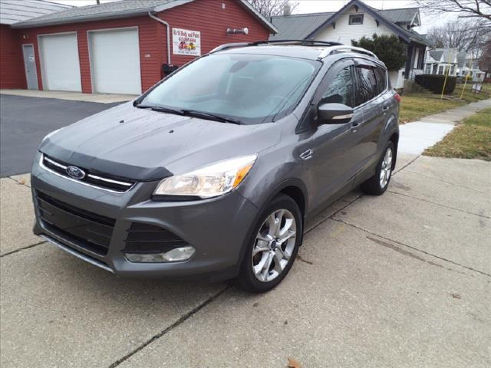 2014 Sterling Gray Metallic Ford Escape Titanium (1FMCU9J99EU) with an 2.0L EcoBoost 2.0L Turbo I4 24 Direct Injection engine, 6-Speed Shiftable Automatic transmission, located at 5505 N. Summit St., Toledo, OH, 43611, (419) 729-2688, 41.654953, -83.530014 - Photo #21