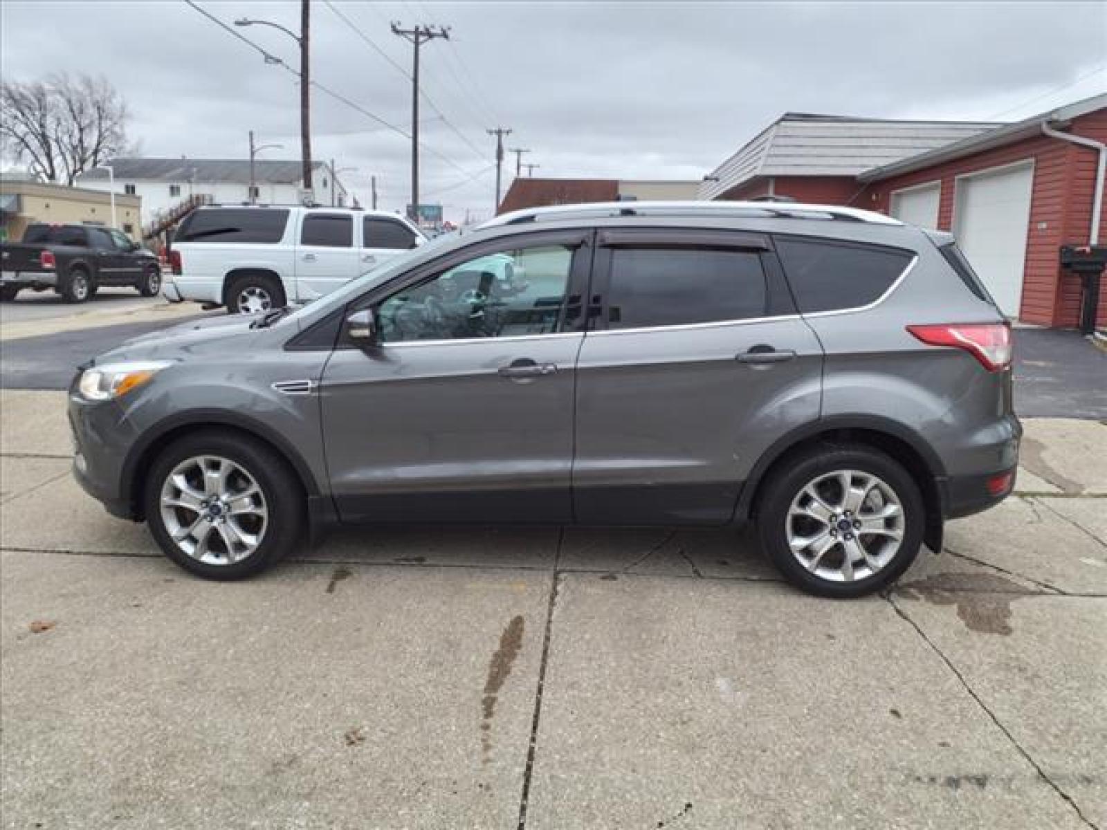 2014 Sterling Gray Metallic Ford Escape Titanium (1FMCU9J99EU) with an 2.0L EcoBoost 2.0L Turbo I4 24 Direct Injection engine, 6-Speed Shiftable Automatic transmission, located at 5505 N. Summit St., Toledo, OH, 43611, (419) 729-2688, 41.654953, -83.530014 - Photo #22