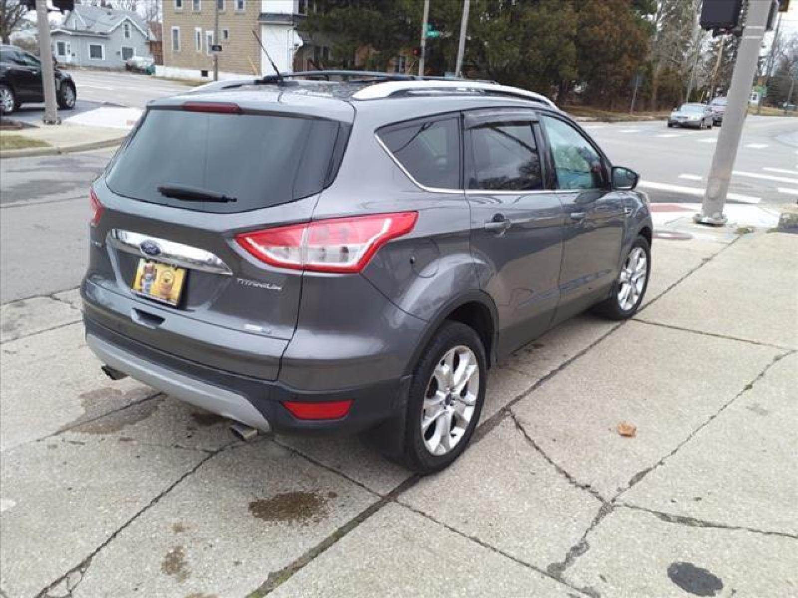 2014 Sterling Gray Metallic Ford Escape Titanium (1FMCU9J99EU) with an 2.0L EcoBoost 2.0L Turbo I4 24 Direct Injection engine, 6-Speed Shiftable Automatic transmission, located at 5505 N. Summit St., Toledo, OH, 43611, (419) 729-2688, 41.654953, -83.530014 - Photo #25