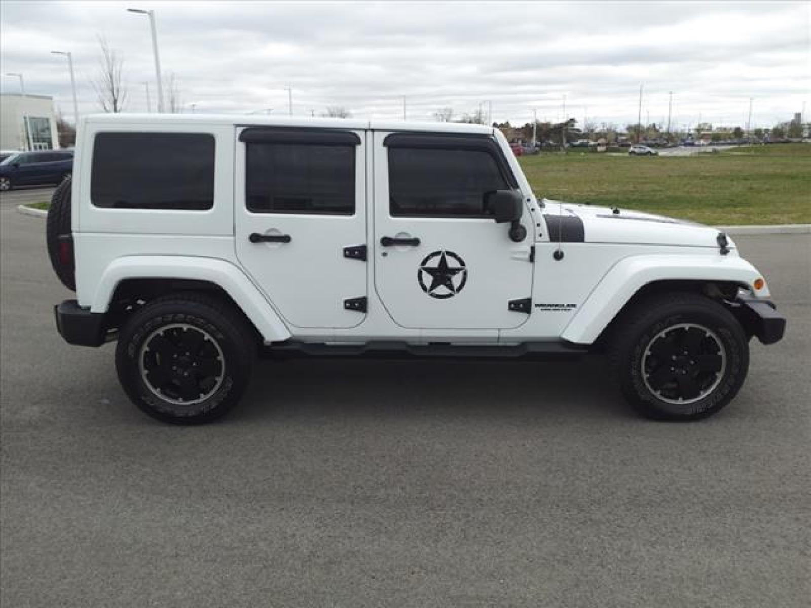 2012 Bright White Clear Coat Jeep Wrangler Unlimited Sahara (1C4BJWEG5CL) with an 3.6L 3.6L V6 285hp 260ft. lbs. Sequential Multiport Fuel Injection engine, 6-Speed Manual transmission, located at 5505 N. Summit St., Toledo, OH, 43611, (419) 729-2688, 41.654953, -83.530014 - Photo #22