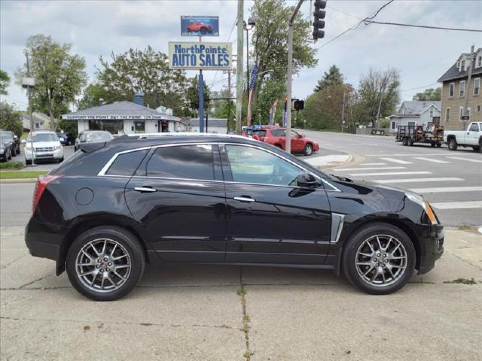 2016 Black Raven Cadillac SRX Performance Collection (3GYFNCE35GS) with an 3.6L 3.6L V6 308hp 265ft. lbs. Direct Injection engine, 6-Speed Automatic transmission, located at 5505 N. Summit St., Toledo, OH, 43611, (419) 729-2688, 41.654953, -83.530014 - Photo #0