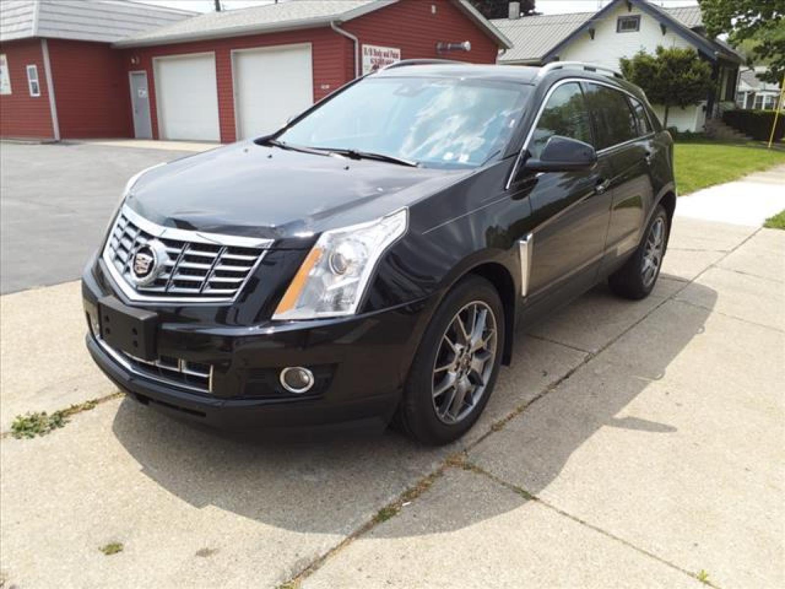2016 Black Raven Cadillac SRX Performance Collection (3GYFNCE35GS) with an 3.6L 3.6L V6 308hp 265ft. lbs. Direct Injection engine, 6-Speed Automatic transmission, located at 5505 N. Summit St., Toledo, OH, 43611, (419) 729-2688, 41.654953, -83.530014 - Photo #22