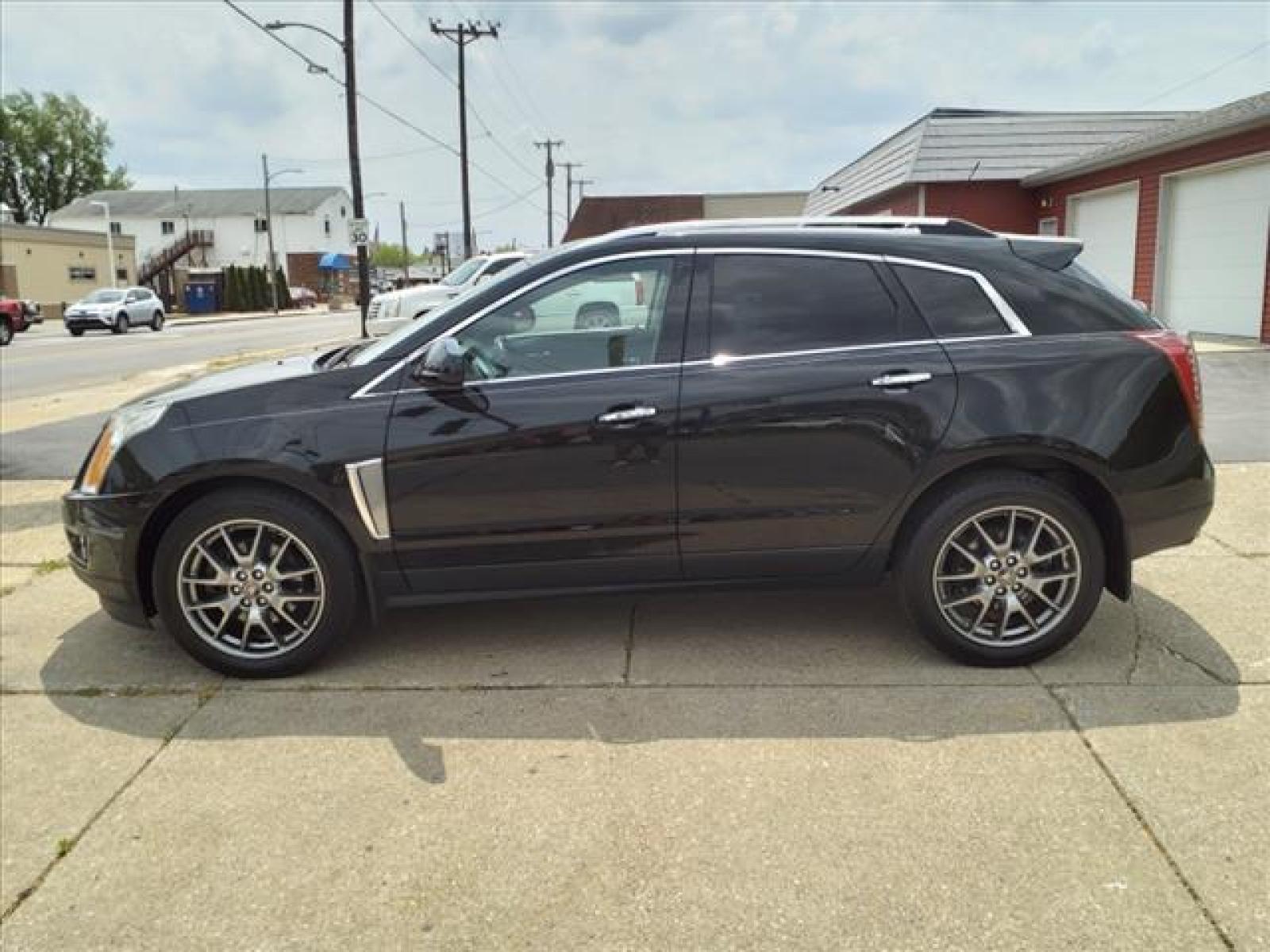 2016 Black Raven Cadillac SRX Performance Collection (3GYFNCE35GS) with an 3.6L 3.6L V6 308hp 265ft. lbs. Direct Injection engine, 6-Speed Automatic transmission, located at 5505 N. Summit St., Toledo, OH, 43611, (419) 729-2688, 41.654953, -83.530014 - Photo #23