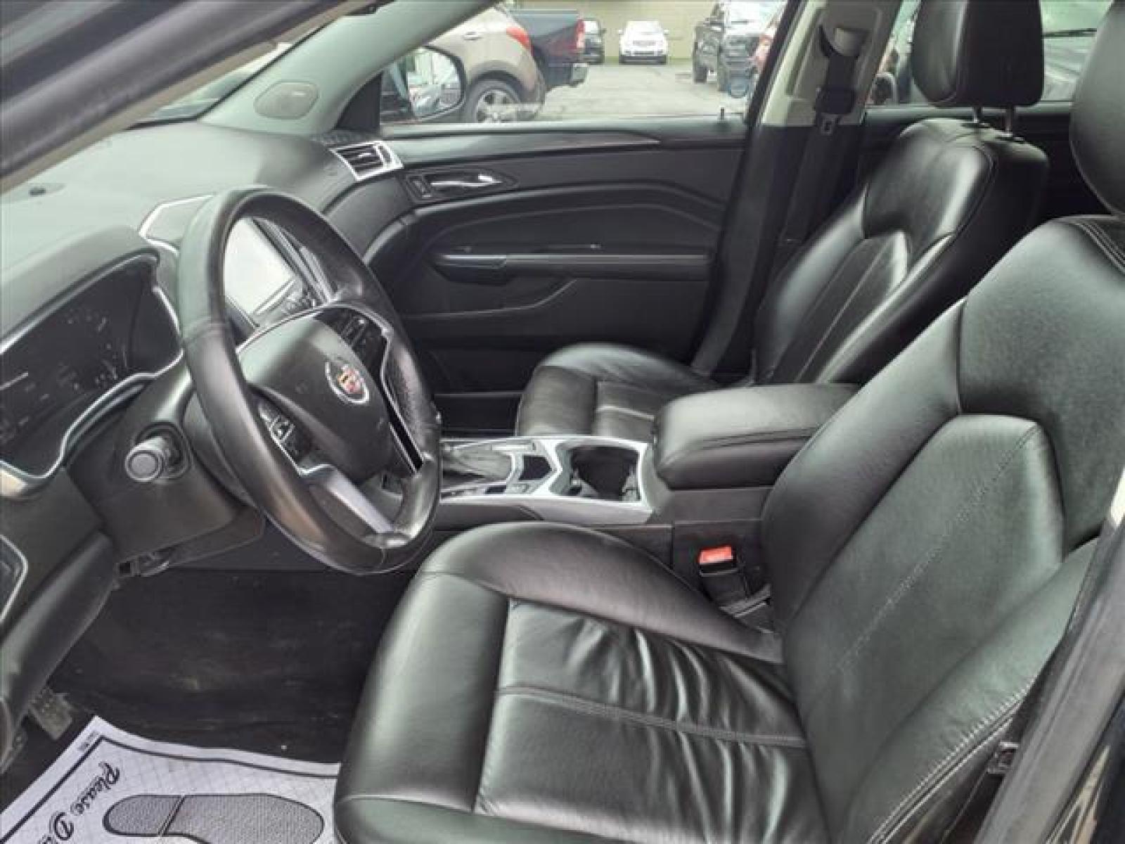 2013 Black Ice Metallic Cadillac SRX Base (3GYFNAE38DS) with an 3.6L 3.6L Flex Fuel V6 308hp 2 Direct Injection engine, 6-Speed Shiftable Automatic transmission, located at 5505 N. Summit St., Toledo, OH, 43611, (419) 729-2688, 41.654953, -83.530014 - Photo #1