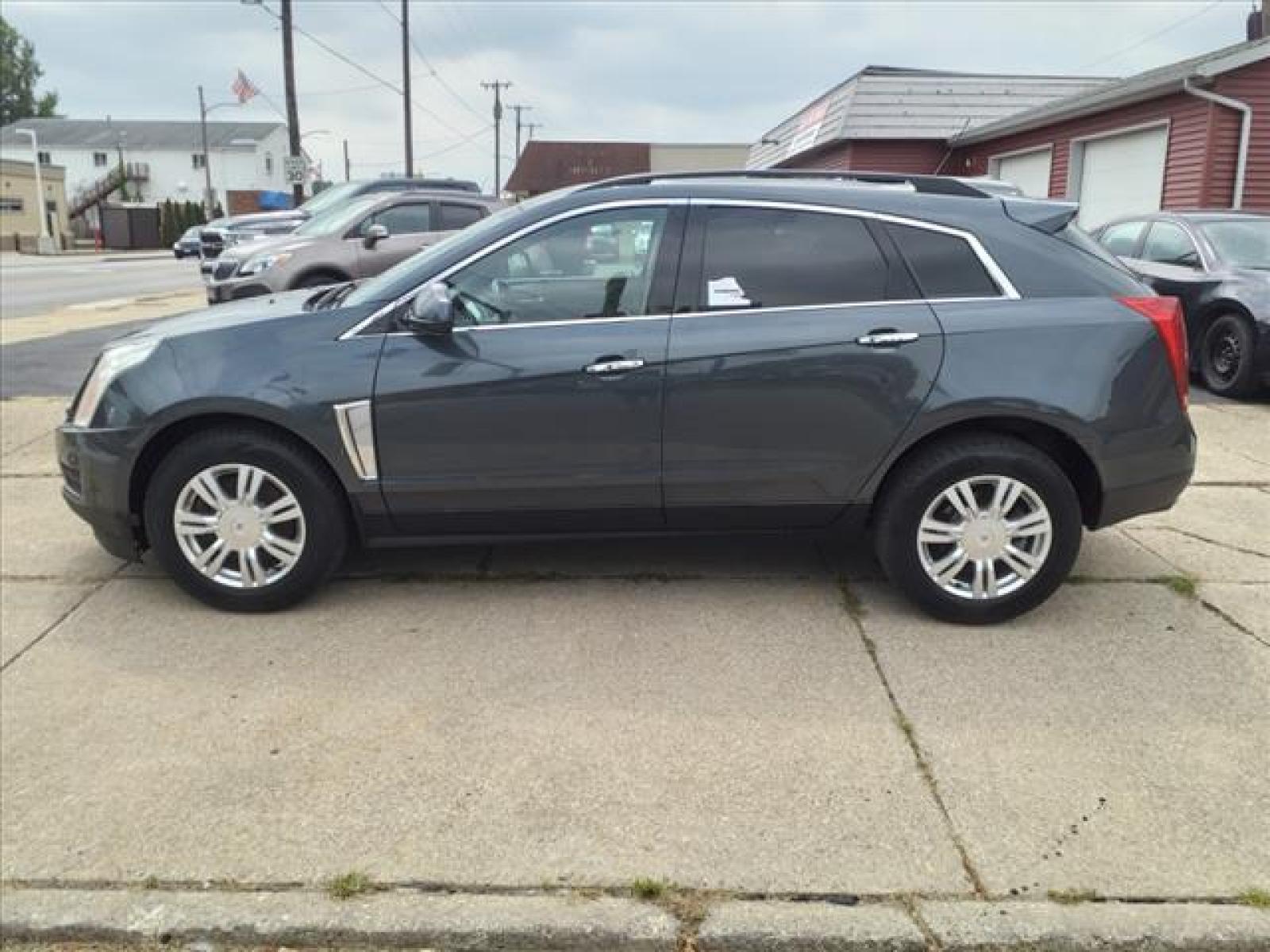2013 Black Ice Metallic Cadillac SRX Base (3GYFNAE38DS) with an 3.6L 3.6L Flex Fuel V6 308hp 2 Direct Injection engine, 6-Speed Shiftable Automatic transmission, located at 5505 N. Summit St., Toledo, OH, 43611, (419) 729-2688, 41.654953, -83.530014 - Photo #20