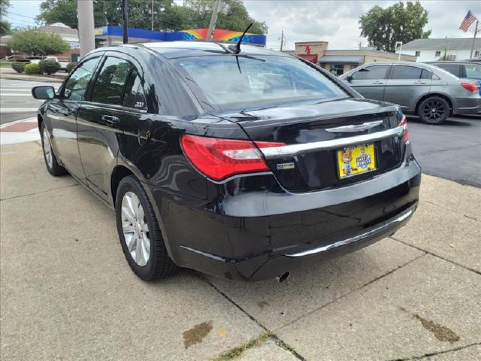 2014 Black Clear Coat Chrysler 200 Touring (1C3CCBBG3EN) with an 3.6L Pentastar 3.6L Flex Fuel Sequential Multiport Fuel Injection engine, 6-Speed Shiftable Automatic transmission, located at 5505 N. Summit St., Toledo, OH, 43611, (419) 729-2688, 41.654953, -83.530014 - Bring your Digital Music collection to life. This baby is ready to RoCk! Just Plug It In! Miles so low there isn't even a french fry under the seat yet. Pop the Top Again! Its fun in the sun with this Roof! Smell the coffee and not the cigarettes in this non-smoker vehicle. Call today to schedul - Photo #17