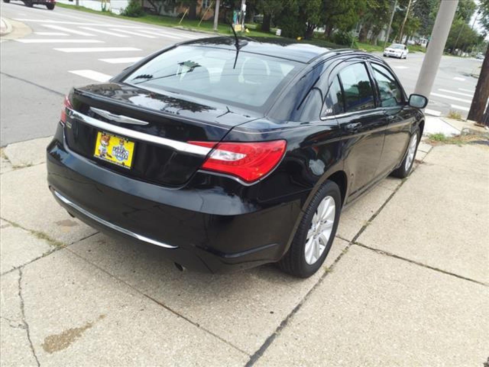 2014 Black Clear Coat Chrysler 200 Touring (1C3CCBBG3EN) with an 3.6L Pentastar 3.6L Flex Fuel Sequential Multiport Fuel Injection engine, 6-Speed Shiftable Automatic transmission, located at 5505 N. Summit St., Toledo, OH, 43611, (419) 729-2688, 41.654953, -83.530014 - Bring your Digital Music collection to life. This baby is ready to RoCk! Just Plug It In! Miles so low there isn't even a french fry under the seat yet. Pop the Top Again! Its fun in the sun with this Roof! Smell the coffee and not the cigarettes in this non-smoker vehicle. Call today to schedul - Photo #19