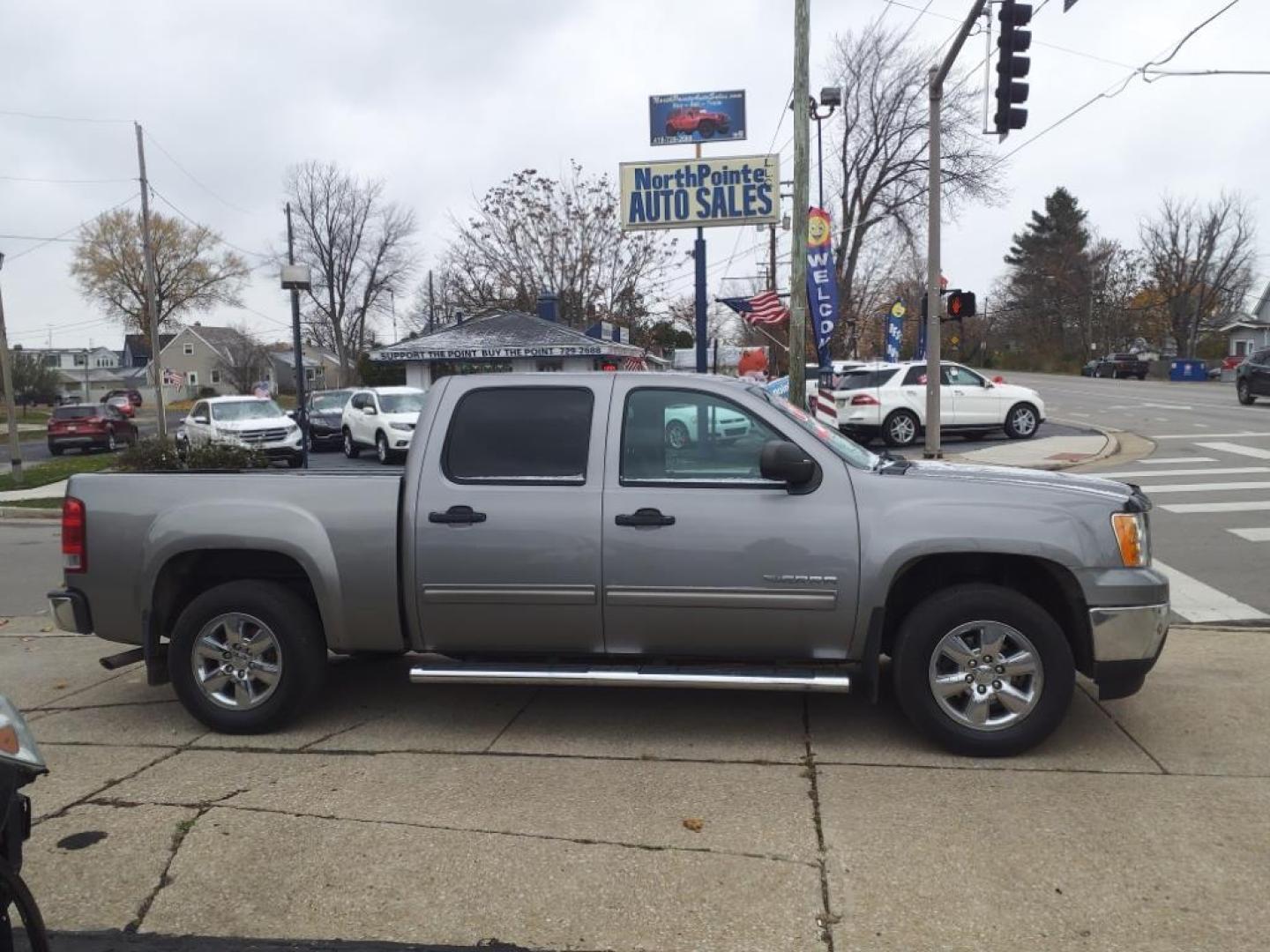 2013 Steel Gray Metallic 16u GMC Sierra 1500 4x4 SLE (3GTP2VEA8DG) with an 4.8L Vortec 4.8L Flex Fuel V8 302hp 305ft. lbs. Sequential-Port F.I. engine, 4-Speed Automatic transmission, located at 5505 N. Summit St., Toledo, OH, 43611, (419) 729-2688, 41.654953, -83.530014 - Photo#0