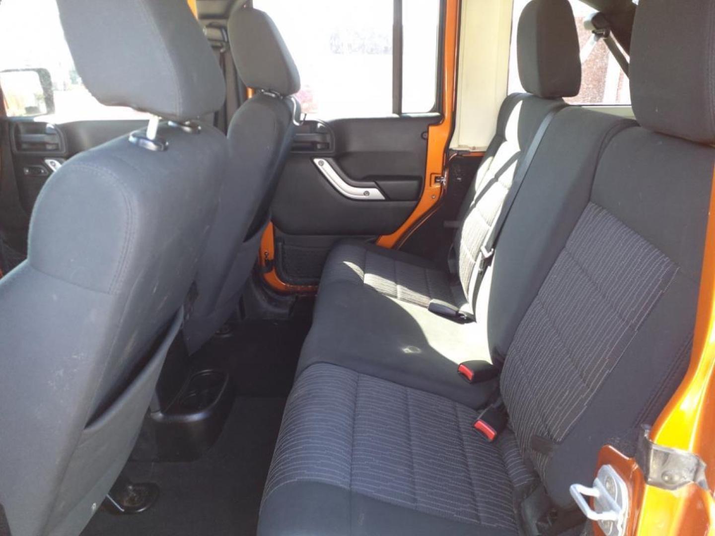 2011 Mango Tango Pearl Coat Pvg Jeep Wrangler Unlimited 4x4 Sahara (1J4BA5H17BL) with an 3.8L 3.8L V6 202hp 237ft. lbs. Sequential Multiport Fuel Injection engine, 4-Speed Automatic transmission, located at 5505 N. Summit St., Toledo, OH, 43611, (419) 729-2688, 41.654953, -83.530014 - Photo#2