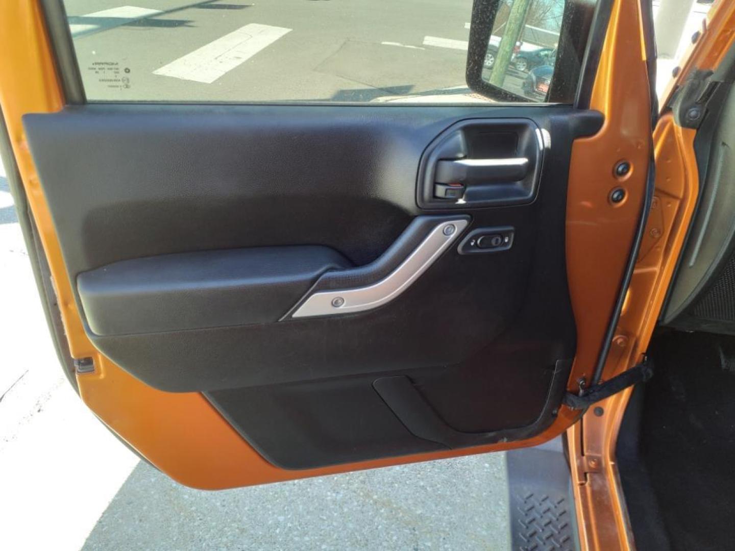 2011 Mango Tango Pearl Coat Pvg Jeep Wrangler Unlimited 4x4 Sahara (1J4BA5H17BL) with an 3.8L 3.8L V6 202hp 237ft. lbs. Sequential Multiport Fuel Injection engine, 4-Speed Automatic transmission, located at 5505 N. Summit St., Toledo, OH, 43611, (419) 729-2688, 41.654953, -83.530014 - Photo#4