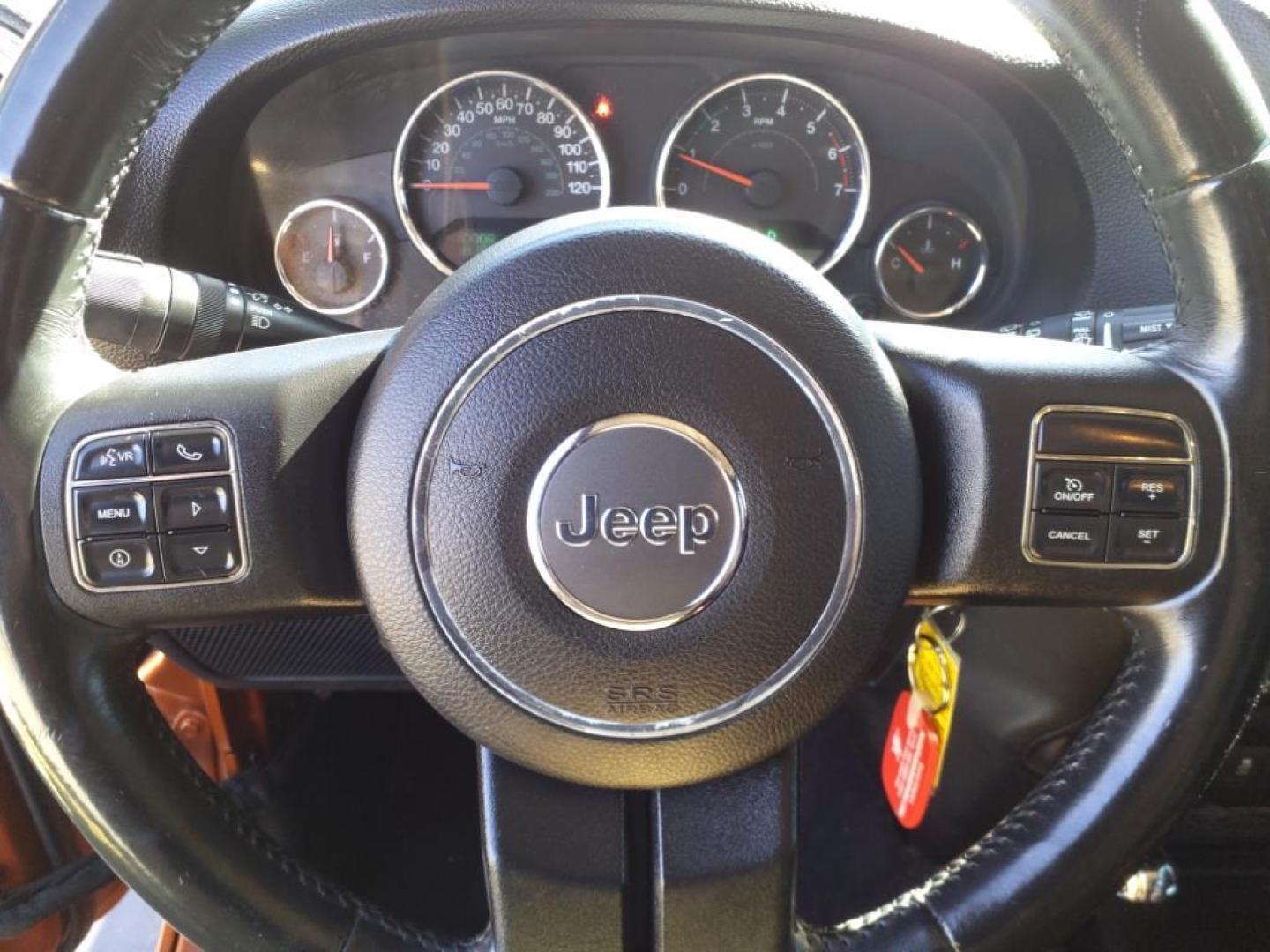 2011 Mango Tango Pearl Coat Pvg Jeep Wrangler Unlimited 4x4 Sahara (1J4BA5H17BL) with an 3.8L 3.8L V6 202hp 237ft. lbs. Sequential Multiport Fuel Injection engine, 4-Speed Automatic transmission, located at 5505 N. Summit St., Toledo, OH, 43611, (419) 729-2688, 41.654953, -83.530014 - Photo#5
