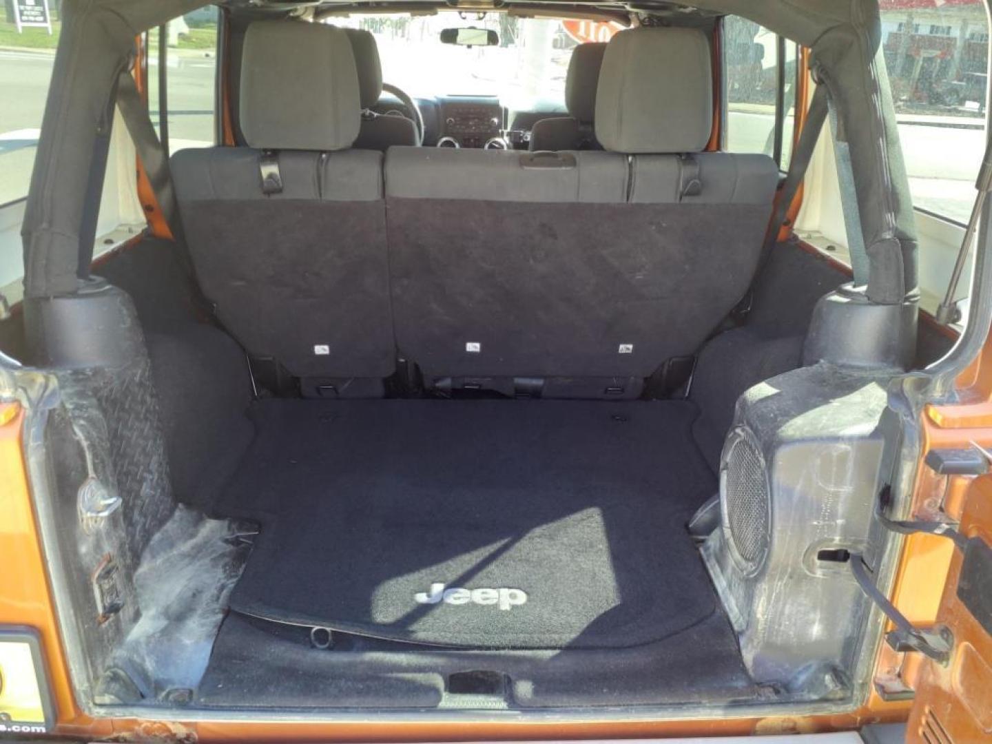 2011 Mango Tango Pearl Coat Pvg Jeep Wrangler Unlimited 4x4 Sahara (1J4BA5H17BL) with an 3.8L 3.8L V6 202hp 237ft. lbs. Sequential Multiport Fuel Injection engine, 4-Speed Automatic transmission, located at 5505 N. Summit St., Toledo, OH, 43611, (419) 729-2688, 41.654953, -83.530014 - Photo#9