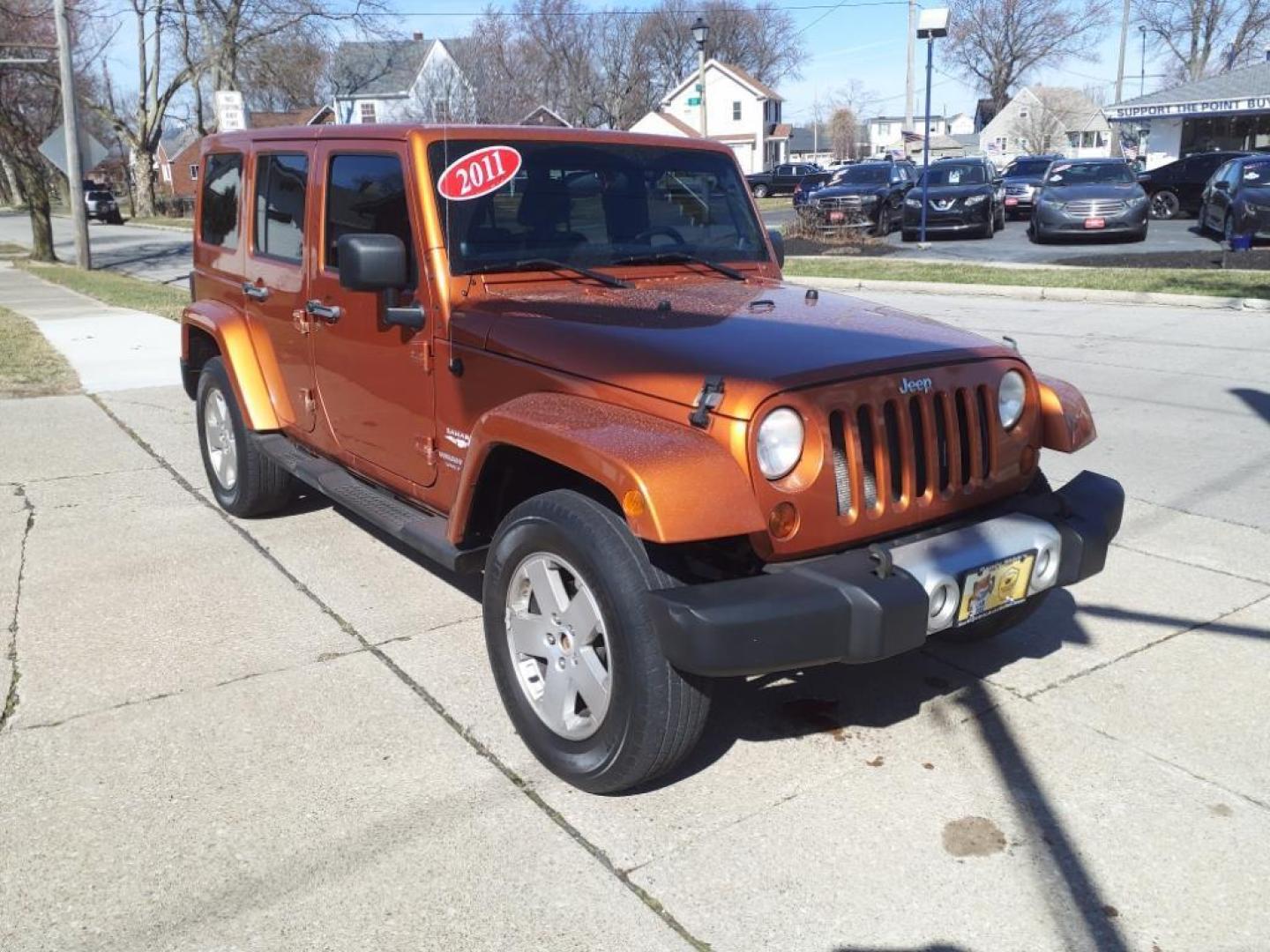 2011 Mango Tango Pearl Coat Pvg Jeep Wrangler Unlimited 4x4 Sahara (1J4BA5H17BL) with an 3.8L 3.8L V6 202hp 237ft. lbs. Sequential Multiport Fuel Injection engine, 4-Speed Automatic transmission, located at 5505 N. Summit St., Toledo, OH, 43611, (419) 729-2688, 41.654953, -83.530014 - Photo#11