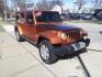 2011 Mango Tango Pearl Coat Pvg Jeep Wrangler Unlimited 4x4 Sahara (1J4BA5H17BL) with an 3.8L 3.8L V6 202hp 237ft. lbs. Sequential Multiport Fuel Injection engine, 4-Speed Automatic transmission, located at 5505 N. Summit St., Toledo, OH, 43611, (419) 729-2688, 41.654953, -83.530014 - Photo#11
