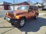2011 Mango Tango Pearl Coat Pvg Jeep Wrangler Unlimited 4x4 Sahara (1J4BA5H17BL) with an 3.8L 3.8L V6 202hp 237ft. lbs. Sequential Multiport Fuel Injection engine, 4-Speed Automatic transmission, located at 5505 N. Summit St., Toledo, OH, 43611, (419) 729-2688, 41.654953, -83.530014 - Photo#13