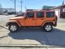 2011 Mango Tango Pearl Coat Pvg Jeep Wrangler Unlimited 4x4 Sahara (1J4BA5H17BL) with an 3.8L 3.8L V6 202hp 237ft. lbs. Sequential Multiport Fuel Injection engine, 4-Speed Automatic transmission, located at 5505 N. Summit St., Toledo, OH, 43611, (419) 729-2688, 41.654953, -83.530014 - Photo#14