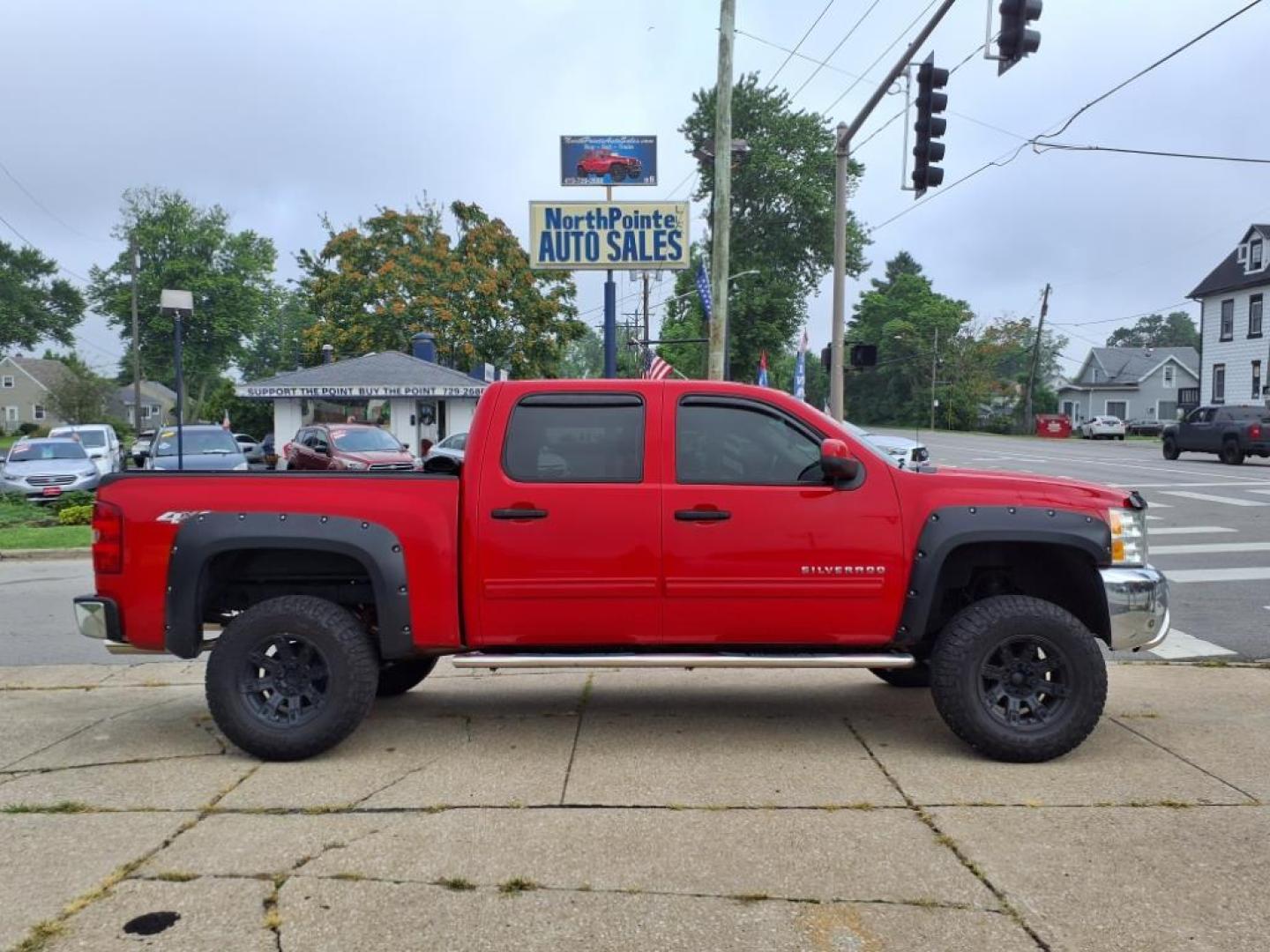 2013 Victory Red 74u Chevrolet Silverado 4x4 LT (3GCPKSE7XDG) with an 5.3L Vortec 5.3L Flex Fuel V8 315hp 335ft. lbs. Sequential-Port F.I. engine, 6-Speed Shiftable Automatic transmission, located at 5505 N. Summit St., Toledo, OH, 43611, (419) 729-2688, 41.654953, -83.530014 - Photo#0