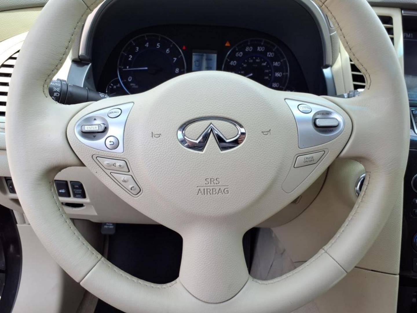 2013 Umbria Twilight INFINITI FX37 AWD Base (JN8CS1MW1DM) with an 3.7L 3.7L V6 325hp 267ft. lbs. Direct Injection engine, 7-Speed Shiftable Automatic transmission, located at 5505 N. Summit St., Toledo, OH, 43611, (419) 729-2688, 41.654953, -83.530014 - Photo#9