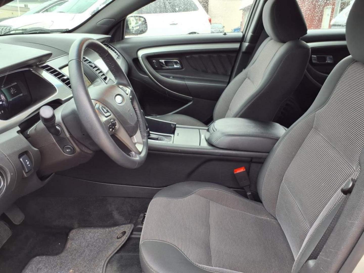 2017 Ingot Silver Ford Taurus AWD SEL (1FAHP2H88HG) with an 3.5L 3.5L V6 288hp 254ft. lbs. Sequential Multiport Fuel Injection engine, 6-Speed Shiftable Automatic transmission, located at 5505 N. Summit St., Toledo, OH, 43611, (419) 729-2688, 41.654953, -83.530014 - Photo#1