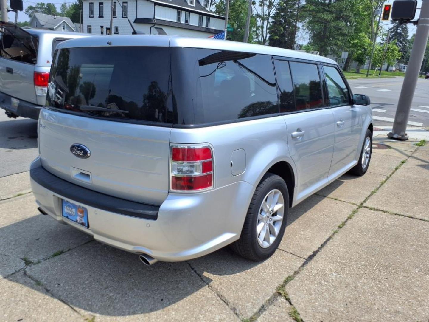 2013 Ingot Silver Metallic Ford Flex SE (2FMGK5B82DB) with an 3.5L 3.5L V6 287hp 254ft. lbs. Sequential Multiport Fuel Injection engine, 6-Speed Shiftable Automatic transmission, located at 5505 N. Summit St., Toledo, OH, 43611, (419) 729-2688, 41.654953, -83.530014 - Photo#21