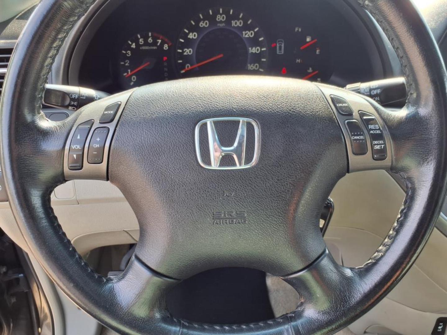 2006 Sage Brush Pearl Honda Odyssey EX-L (5FNRL38666B) with an 3.5L 3L NA V6 single overhead cam (SOHC) 24V Fuel Injected engine, 5-Speed Automatic transmission, located at 5505 N. Summit St., Toledo, OH, 43611, (419) 729-2688, 41.654953, -83.530014 - Photo#9
