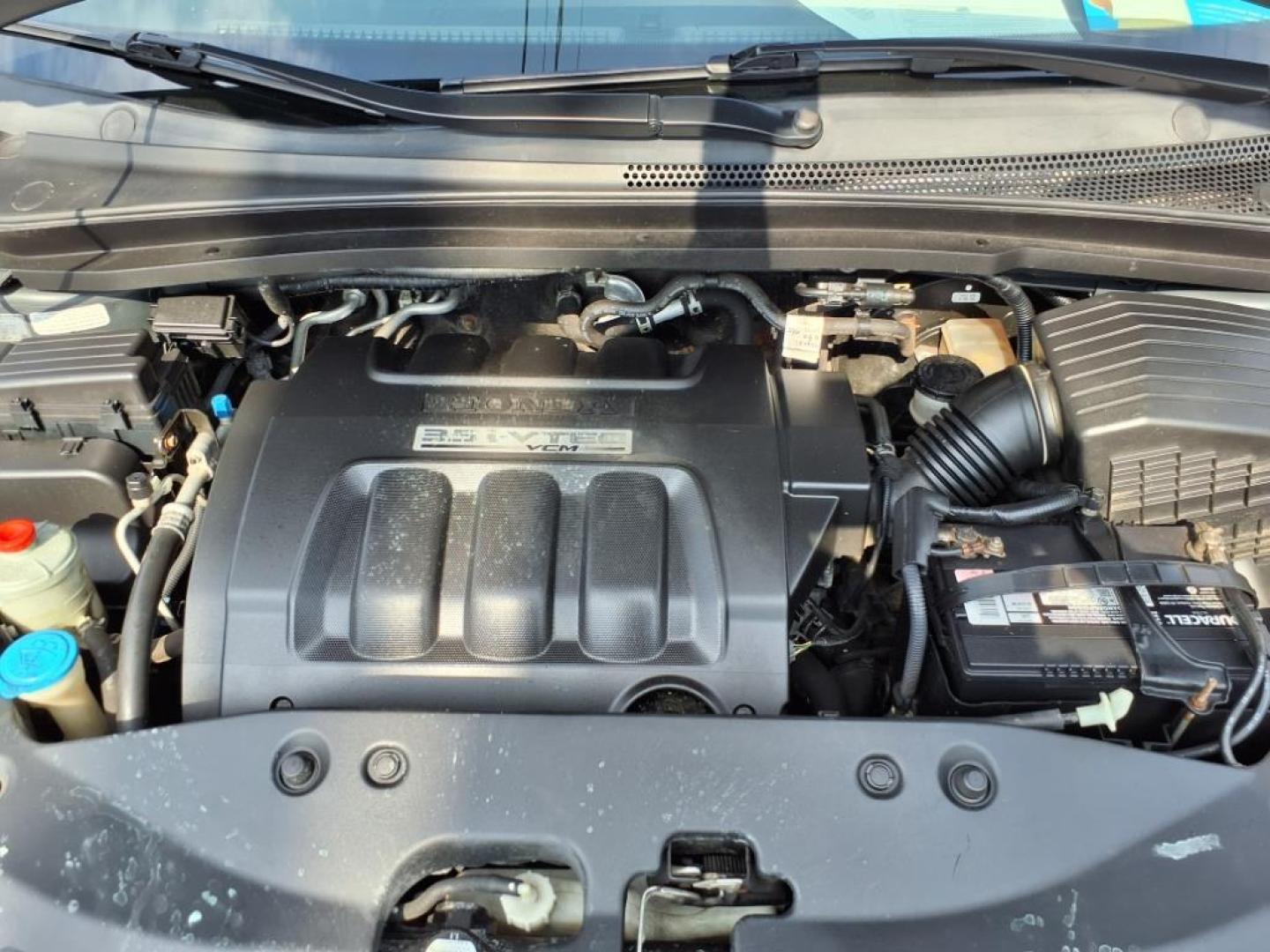 2006 Sage Brush Pearl Honda Odyssey EX-L (5FNRL38666B) with an 3.5L 3L NA V6 single overhead cam (SOHC) 24V Fuel Injected engine, 5-Speed Automatic transmission, located at 5505 N. Summit St., Toledo, OH, 43611, (419) 729-2688, 41.654953, -83.530014 - Photo#17