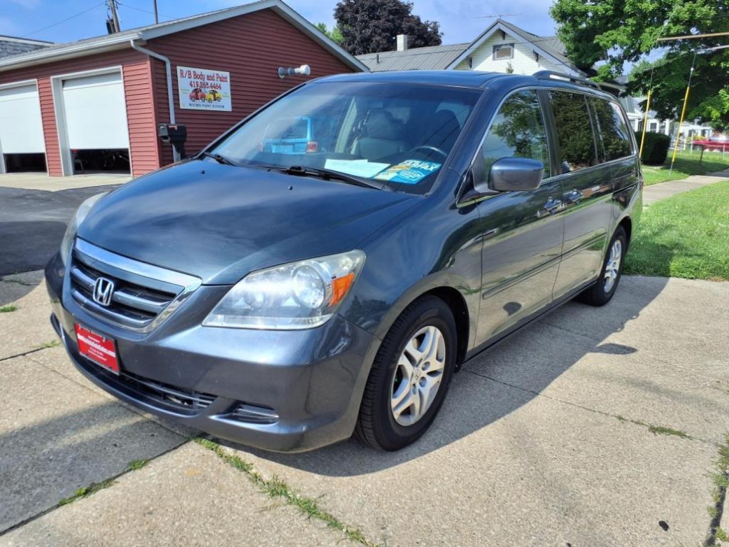 2006 Sage Brush Pearl Honda Odyssey EX-L (5FNRL38666B) with an 3.5L 3L NA V6 single overhead cam (SOHC) 24V Fuel Injected engine, 5-Speed Automatic transmission, located at 5505 N. Summit St., Toledo, OH, 43611, (419) 729-2688, 41.654953, -83.530014 - Photo#20