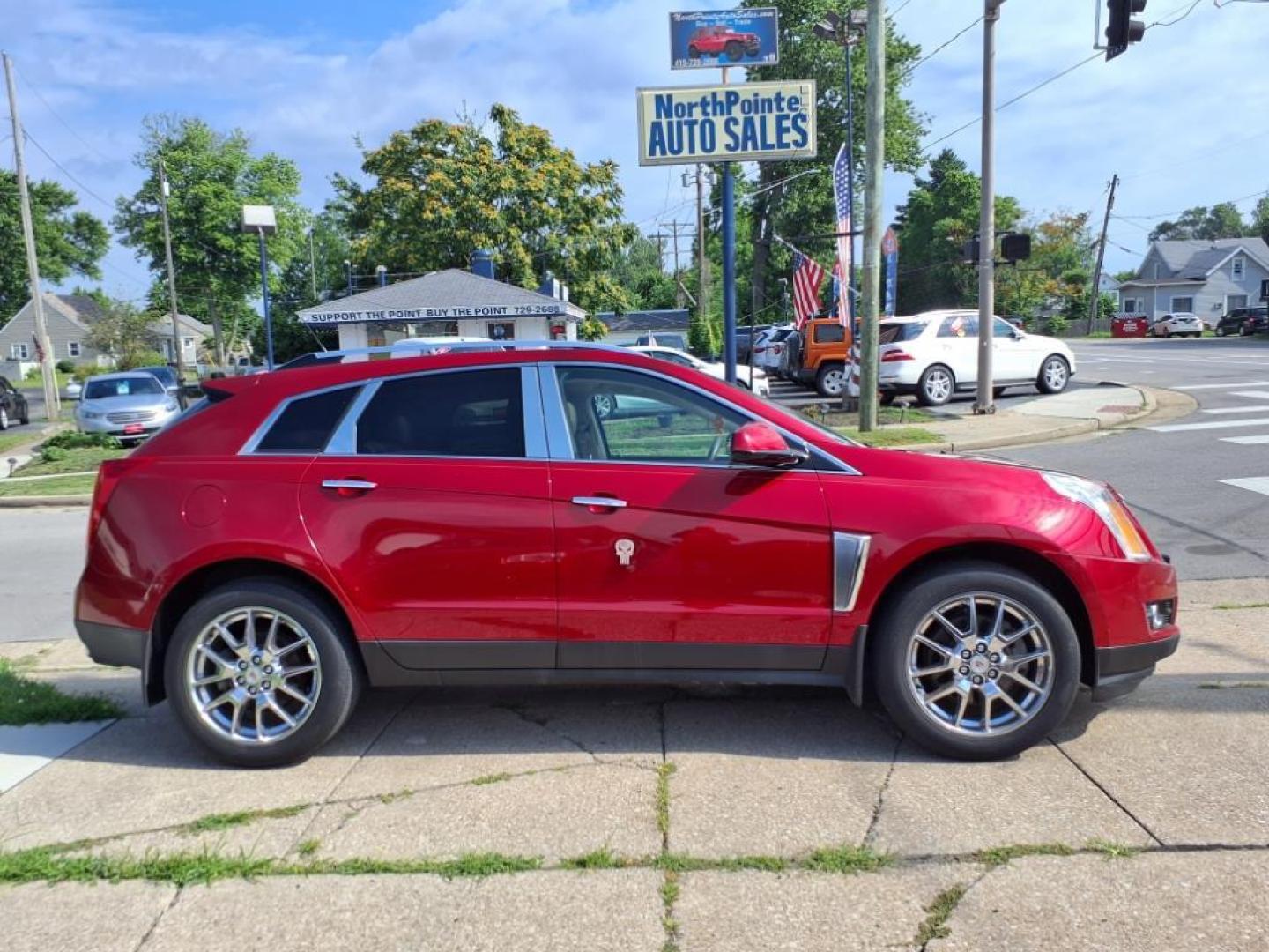 2014 Crystal Red Tintcoat Cadillac SRX Performance Collection (3GYFNCE36ES) with an 3.6L 3.6L V6 308hp 265ft. lbs. Direct Injection engine, 6-Speed Shiftable Automatic transmission, located at 5505 N. Summit St., Toledo, OH, 43611, (419) 729-2688, 41.654953, -83.530014 - Photo#0