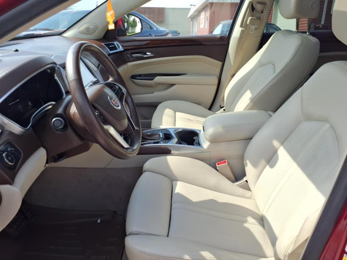 2014 Crystal Red Tintcoat Cadillac SRX Performance Collection (3GYFNCE36ES) with an 3.6L 3.6L V6 308hp 265ft. lbs. Direct Injection engine, 6-Speed Shiftable Automatic transmission, located at 5505 N. Summit St., Toledo, OH, 43611, (419) 729-2688, 41.654953, -83.530014 - Photo#2