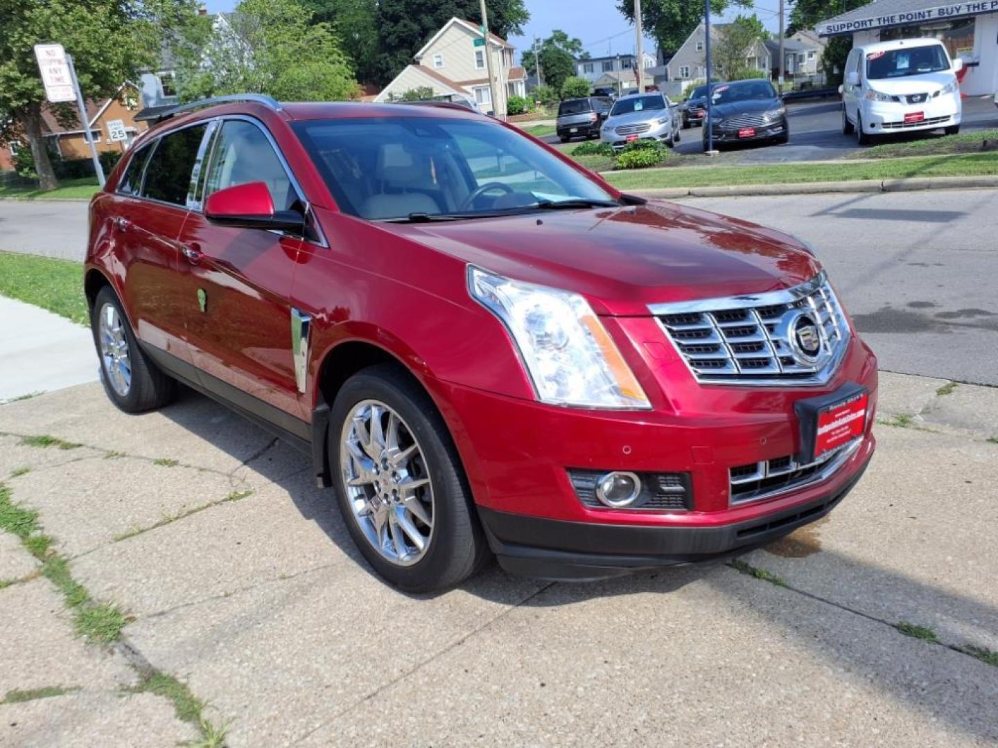 2014 Crystal Red Tintcoat Cadillac SRX Performance Collection (3GYFNCE36ES) with an 3.6L 3.6L V6 308hp 265ft. lbs. Direct Injection engine, 6-Speed Shiftable Automatic transmission, located at 5505 N. Summit St., Toledo, OH, 43611, (419) 729-2688, 41.654953, -83.530014 - Photo#20