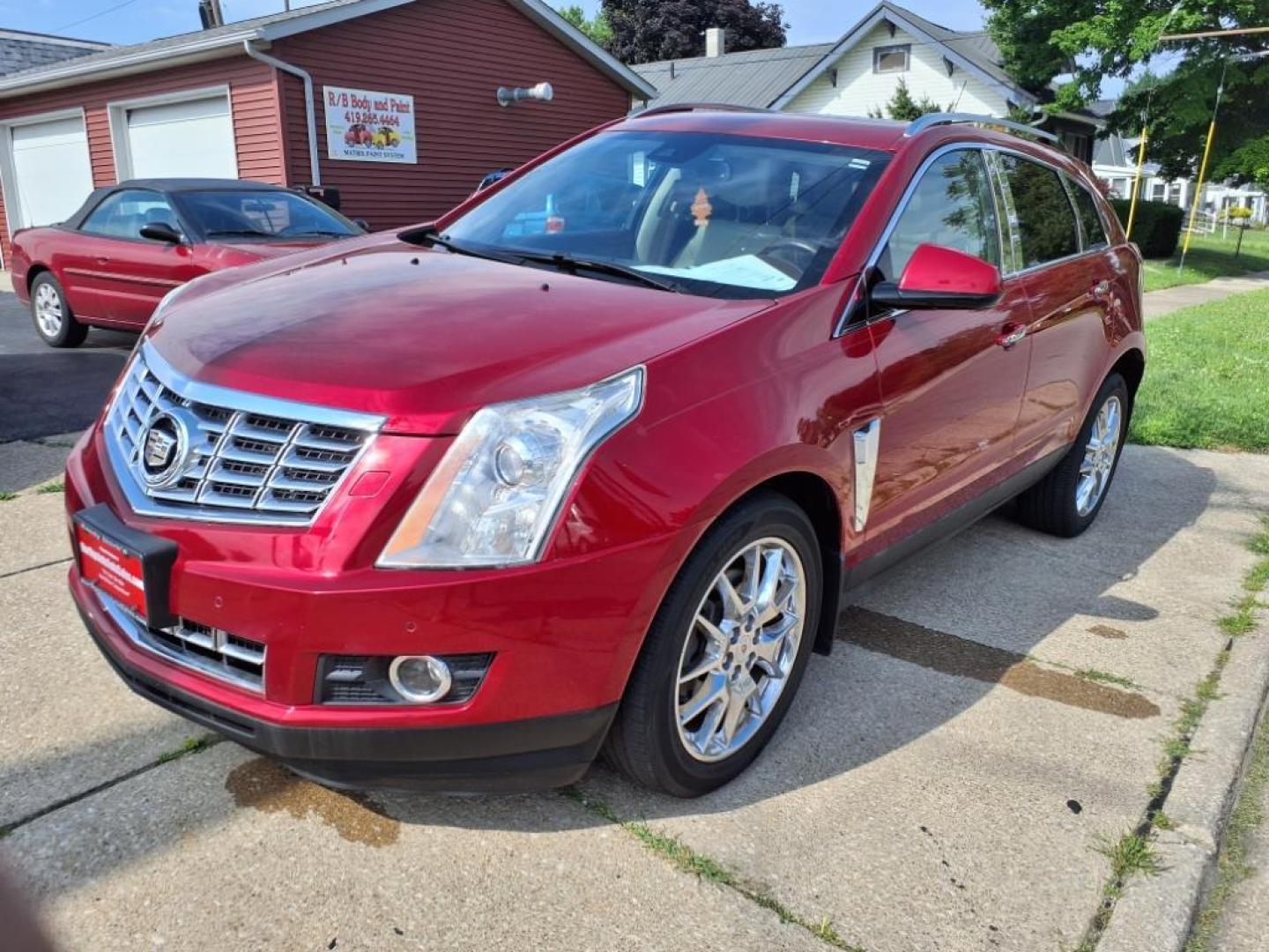 2014 Crystal Red Tintcoat Cadillac SRX Performance Collection (3GYFNCE36ES) with an 3.6L 3.6L V6 308hp 265ft. lbs. Direct Injection engine, 6-Speed Shiftable Automatic transmission, located at 5505 N. Summit St., Toledo, OH, 43611, (419) 729-2688, 41.654953, -83.530014 - Photo#22