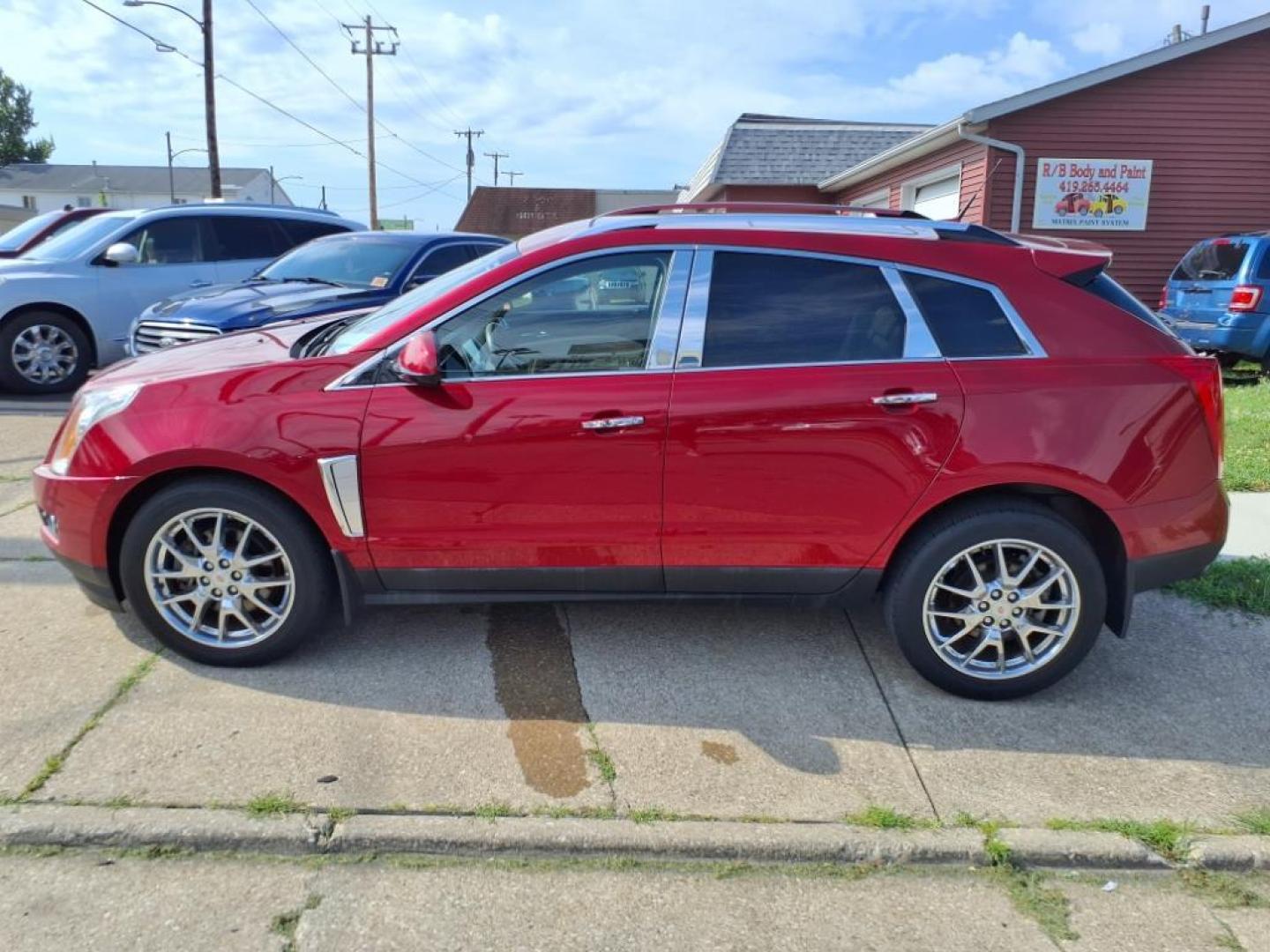 2014 Crystal Red Tintcoat Cadillac SRX Performance Collection (3GYFNCE36ES) with an 3.6L 3.6L V6 308hp 265ft. lbs. Direct Injection engine, 6-Speed Shiftable Automatic transmission, located at 5505 N. Summit St., Toledo, OH, 43611, (419) 729-2688, 41.654953, -83.530014 - Photo#23