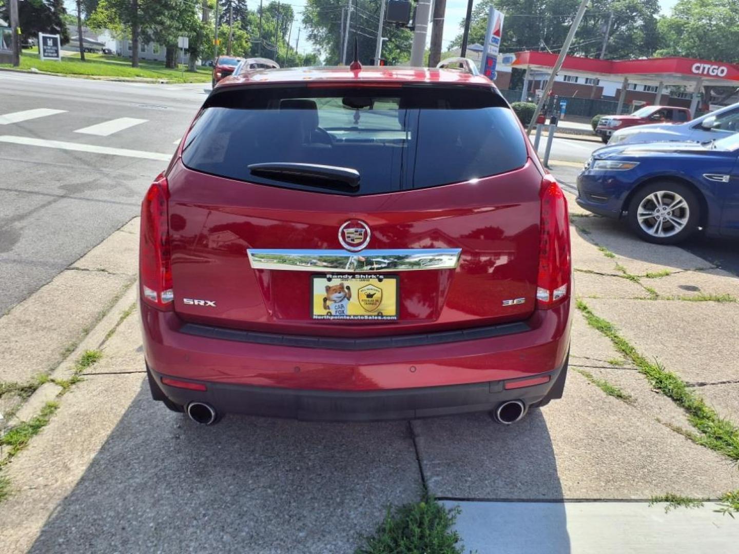 2014 Crystal Red Tintcoat Cadillac SRX Performance Collection (3GYFNCE36ES) with an 3.6L 3.6L V6 308hp 265ft. lbs. Direct Injection engine, 6-Speed Shiftable Automatic transmission, located at 5505 N. Summit St., Toledo, OH, 43611, (419) 729-2688, 41.654953, -83.530014 - Photo#25