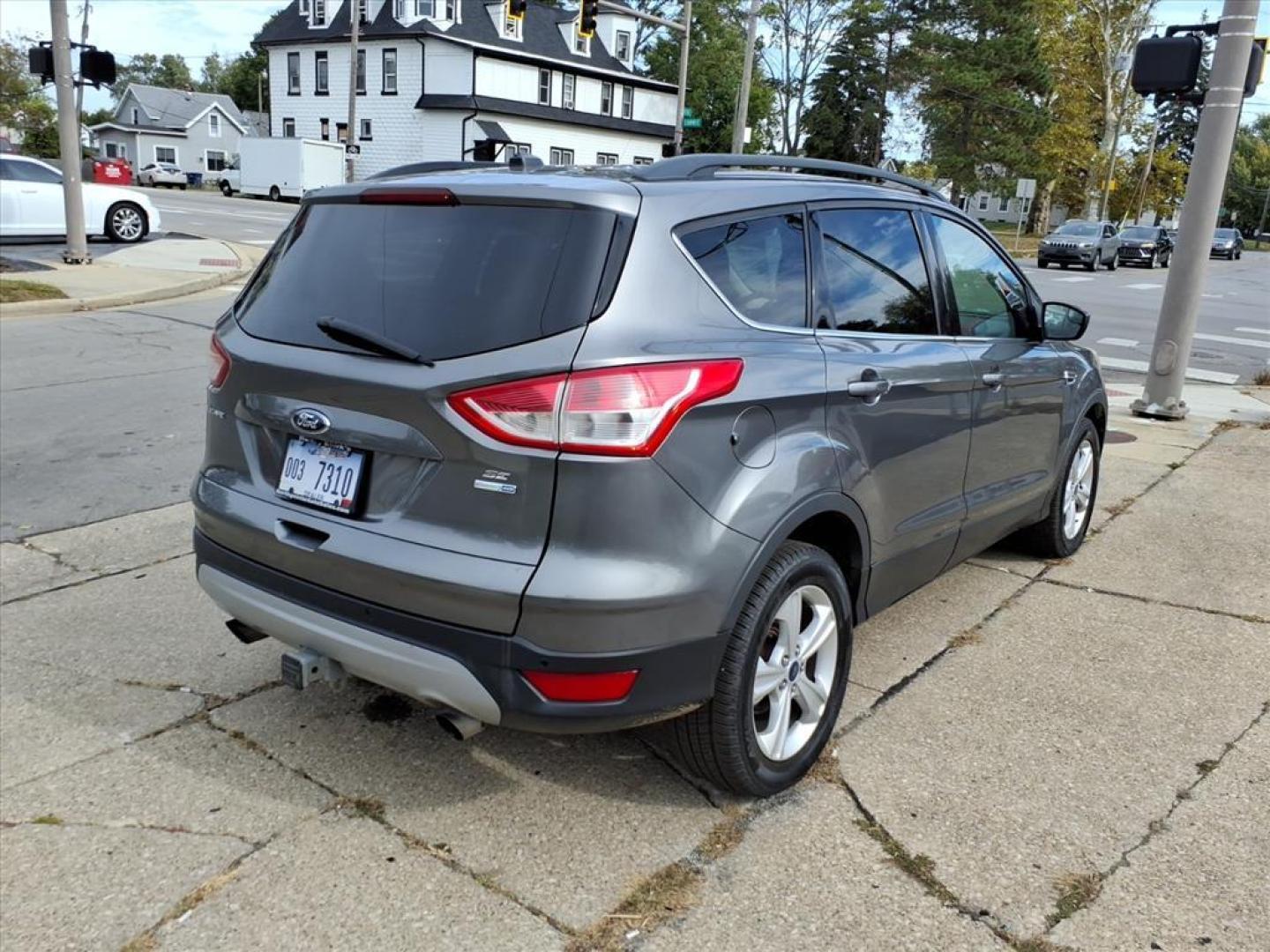 2014 Sterling Gray Metallic Ford Escape SE (1FMCU9G93EU) with an 2.0L EcoBoost 2.0L Turbo I4 240hp 270ft. lbs. Direct Injection engine, 6-Speed Shiftable Automatic transmission, located at 5505 N. Summit St., Toledo, OH, 43611, (419) 729-2688, 41.654953, -83.530014 - Photo#25