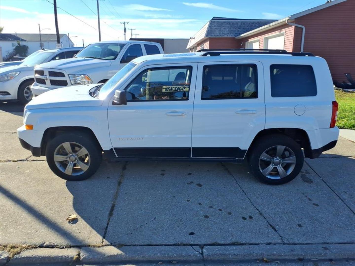 2015 Bright White Clear Coat Jeep Patriot High Altitude Edition (1C4NJRFB9FD) with an 2.4L 2.4L I4 172hp 165ft. lbs. Sequential Multiport Fuel Injection engine, 6-Speed Shiftable Automatic transmission, located at 5505 N. Summit St., Toledo, OH, 43611, (419) 729-2688, 41.654953, -83.530014 - Photo#17