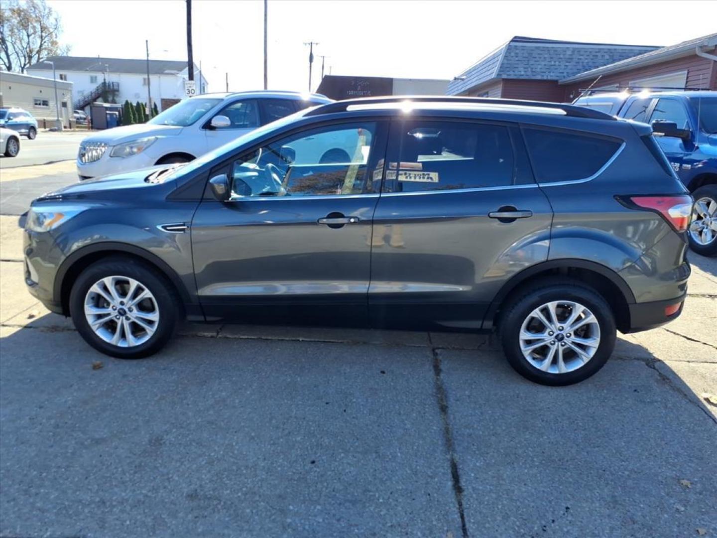 2017 Magnetic Ford Escape SE (1FMCU9GD4HU) with an 1.5L EcoBoost 1.5L Turbo I4 179hp 177ft. lbs. Direct Injection engine, 6-Speed Shiftable Automatic transmission, located at 5505 N. Summit St., Toledo, OH, 43611, (419) 729-2688, 41.654953, -83.530014 - Photo#21
