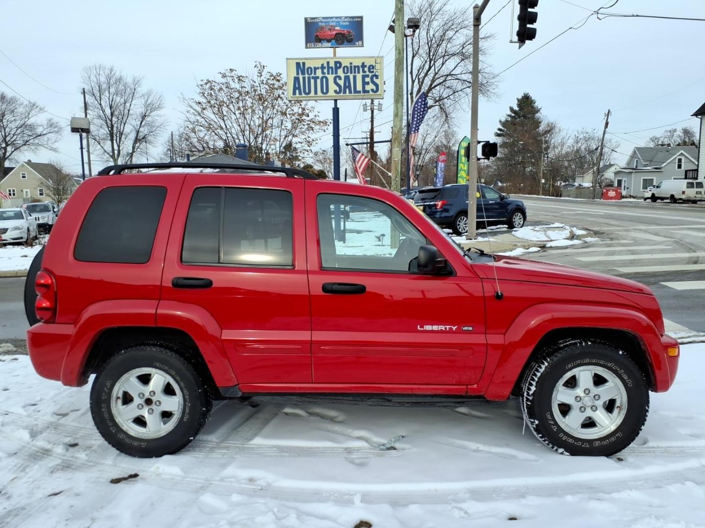 2003 Flame Red Clearcoat Pr4 Jeep Liberty Limited (1J4GL58K73W) with an 3.7L 3.7L V6 210hp 235ft. lbs. Fuel Injected engine, 4-Speed Automatic transmission, located at 5505 N. Summit St., Toledo, OH, 43611, (419) 729-2688, 41.654953, -83.530014 - Photo#0