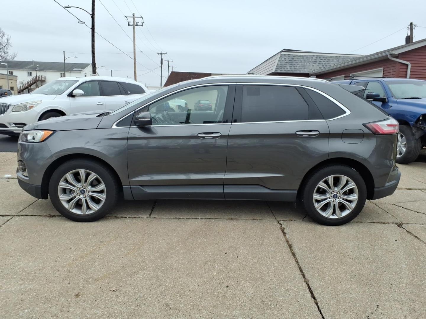 2019 Dk. Gray Ford Edge Titanium (2FMPK4K9XKB) with an 2.0L EcoBoost 2.0L Turbo I4 250hp 280ft. lbs. Direct Injection engine, 8-Speed Shiftable Automatic transmission, located at 5505 N. Summit St., Toledo, OH, 43611, (419) 729-2688, 41.654953, -83.530014 - Photo#22